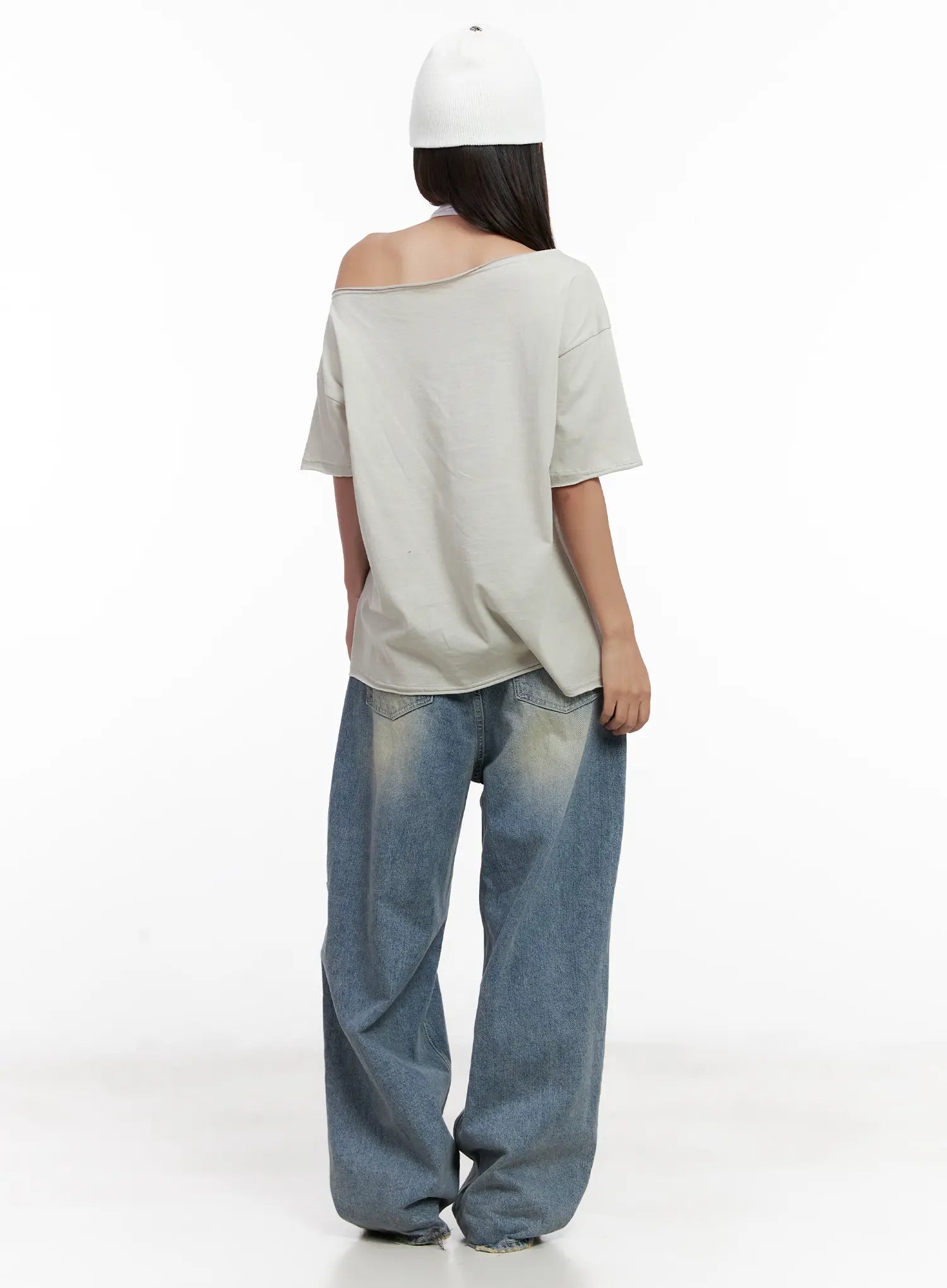 Manon Washed Distressed Wide Jeans CL518 in blue, back full-body shot styled with oversized off-shoulder tee, showing washed fading on wide-leg rear, pooled hem at floor.