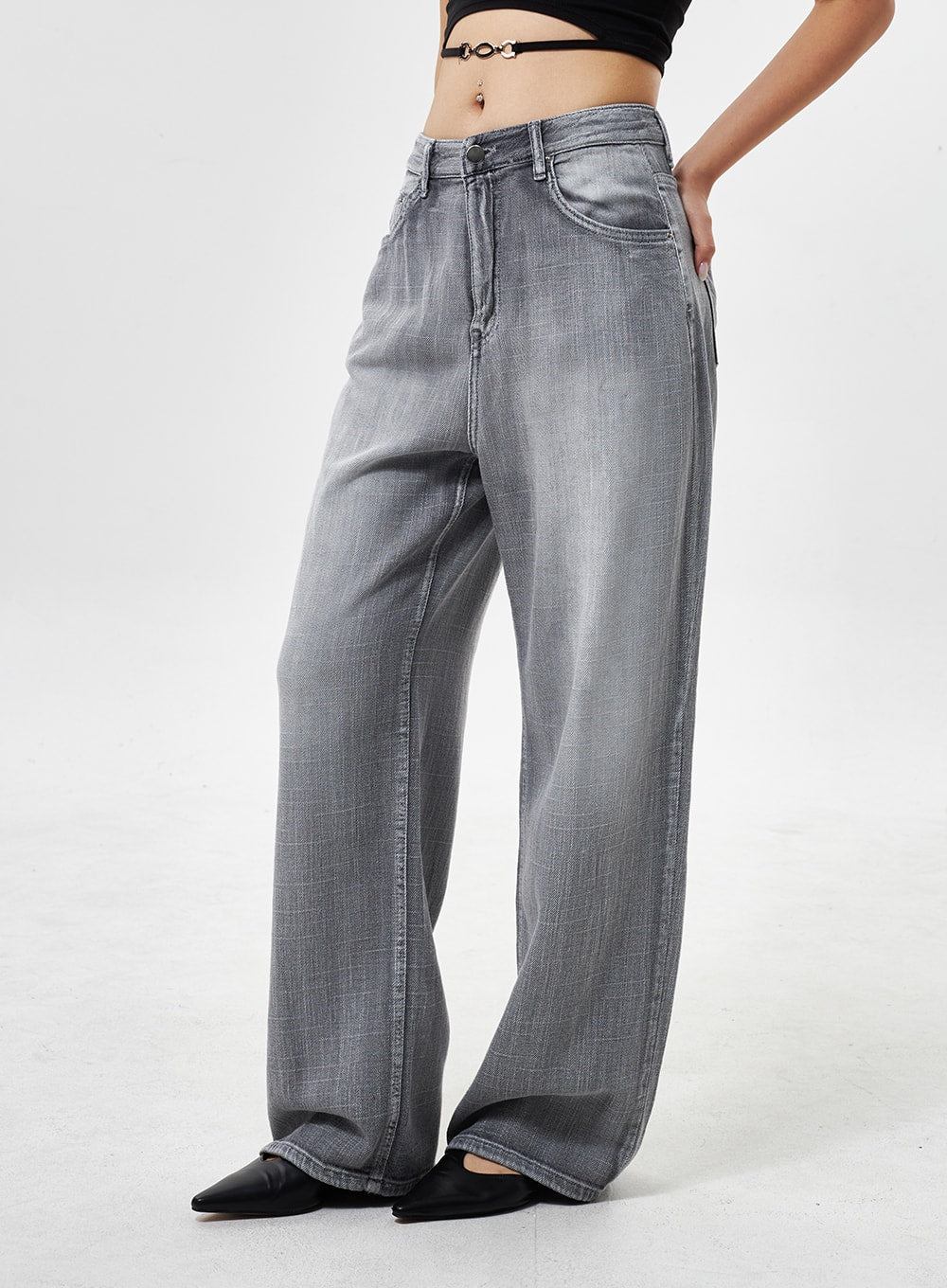 Mid-Rise Wide Leg Jeans CY330 in grey, side close-up on model, mid-rise waist with front pocket, wide-leg faded denim texture visible, floor-grazing length.