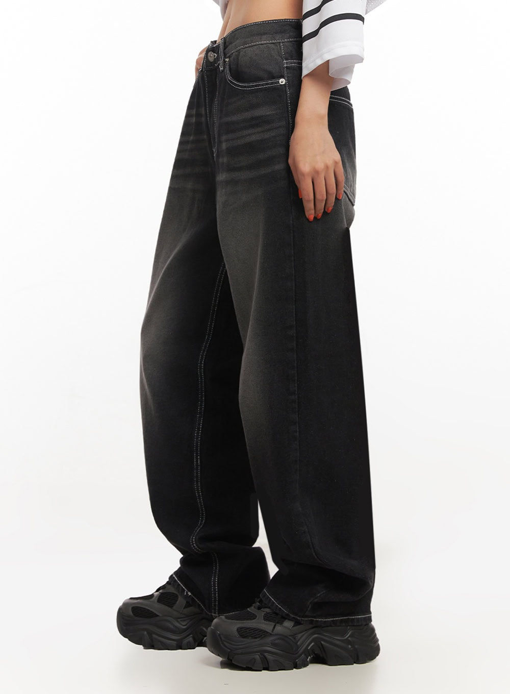 Alexis Stitched Wide-Leg Jeans IA504 in washed black, side close-up waist-to-hem on model, showing mid-rise waistband, contrast white seam stitching, and wide-leg silhouette in washed cotton.