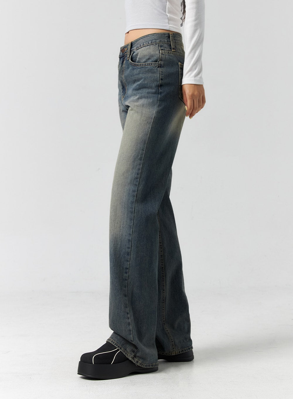 Vintage Wash Bootcut Jeans CS305 in blue, side view from waist to hem on model, clearly showing bootcut flare at ankle and vintage wash gradient on cotton denim.