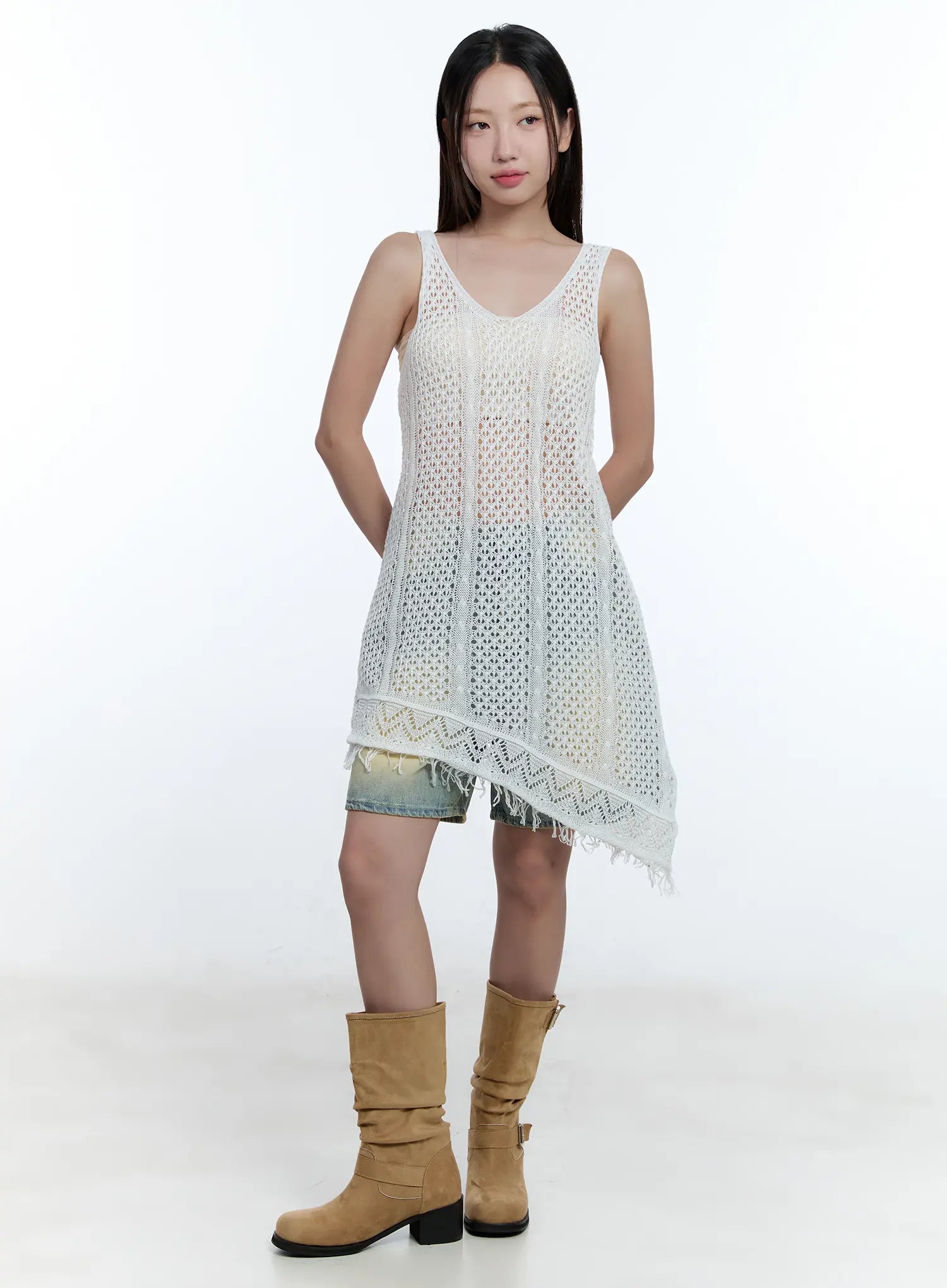 Vintage Wash Jorts CU527 in light blue, front full-body shot on model, wide-leg denim hem visible under white crochet asymmetric dress, styled with tan knee boots.