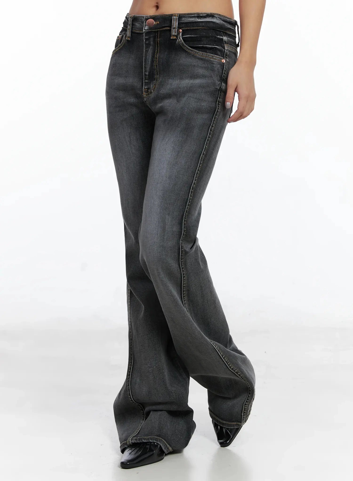 Phoe Flared Jeans ID503 in washed grey, side view from waist to hem on model, showing slim thigh through knee with dramatic flare silhouette and contrast topstitching.