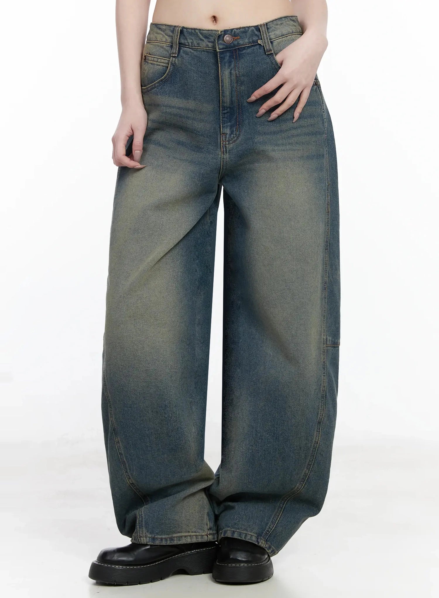 Tata Vintage Dark Blue Washed Wide Leg Jeans IJ528 in dark blue, front cropped shot from waist to hem without top styled, wide fit balloon leg with curved panel seam, yellow-tinted vintage wash gradient, black platform loafers.