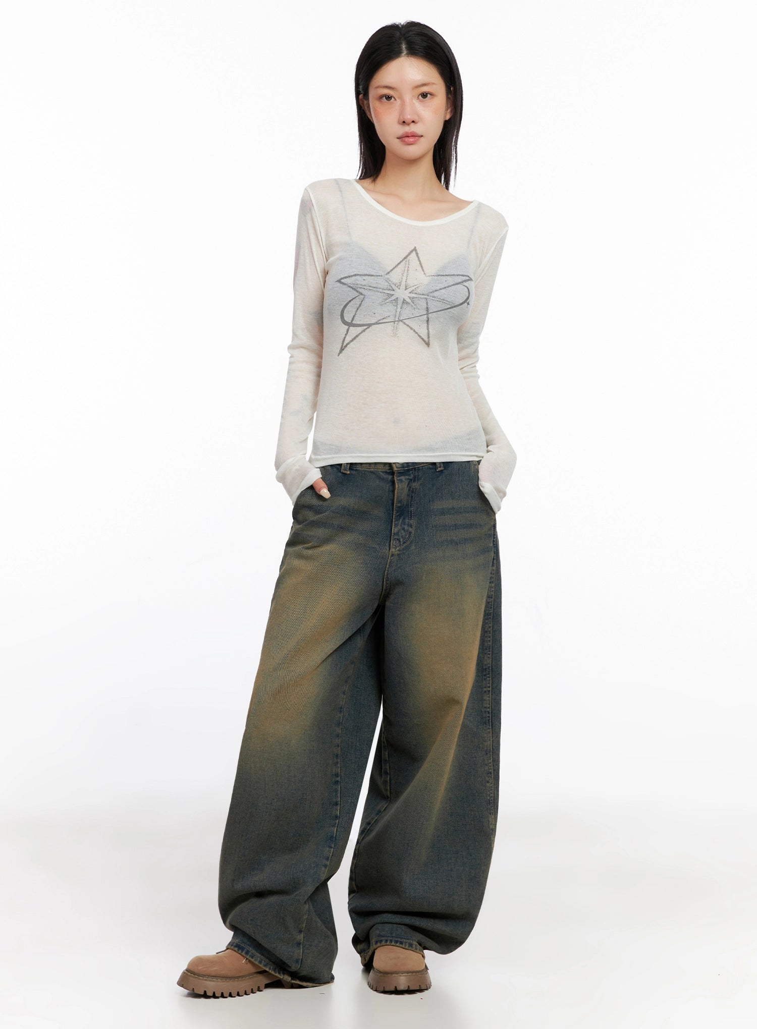 Minju Vintage Washed Baggy Jeans IS508 in dark blue, front full-body on model, styled with sheer white star-print long sleeve top and brown chunky boots, casual acubi street look.