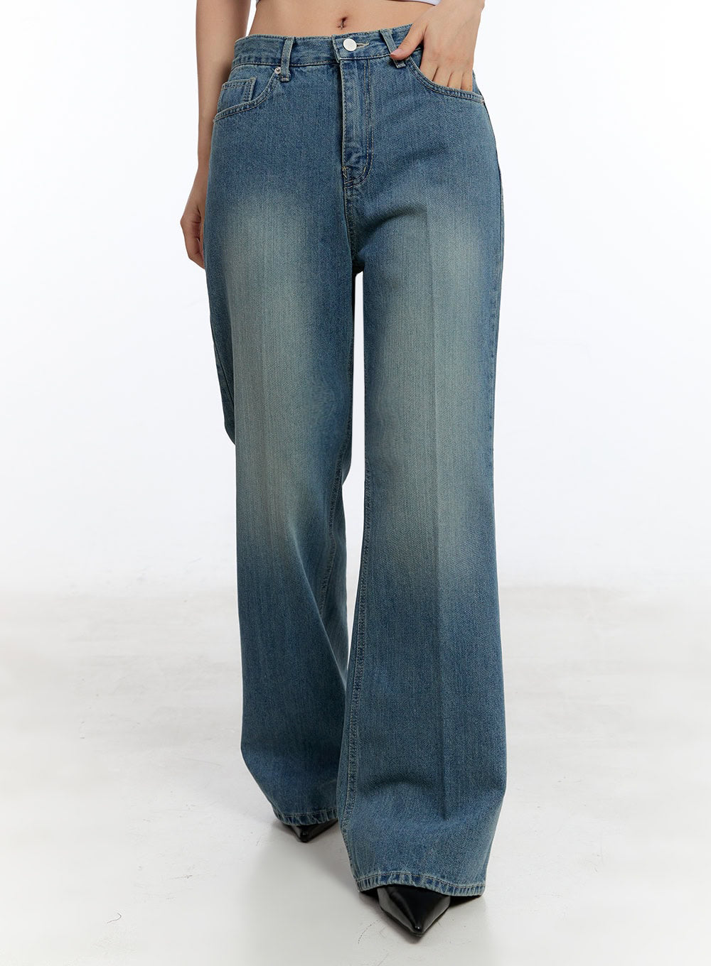 Aliya Washed Bootcut Jeans IU503 in dark blue, front mid-shot from waist to ankle on model, wide wide-fit washed denim, faded wash gradient, bootcut flare at hem, button closure.