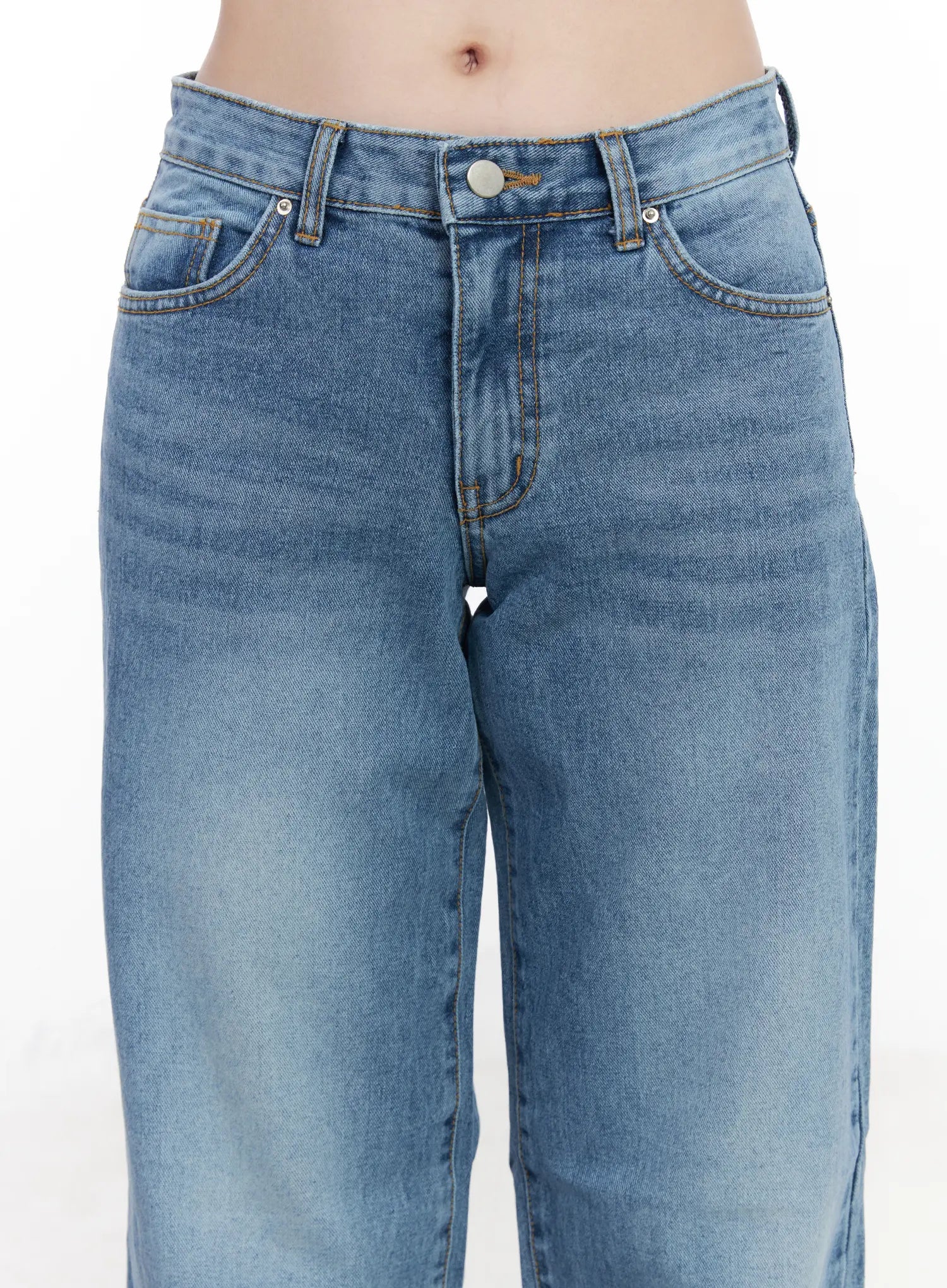Maisy Casual Wide Leg Jeans CJ519 in blue, waist close-up on model, front pockets, silver button, contrast orange stitching, and washed denim texture clearly visible.