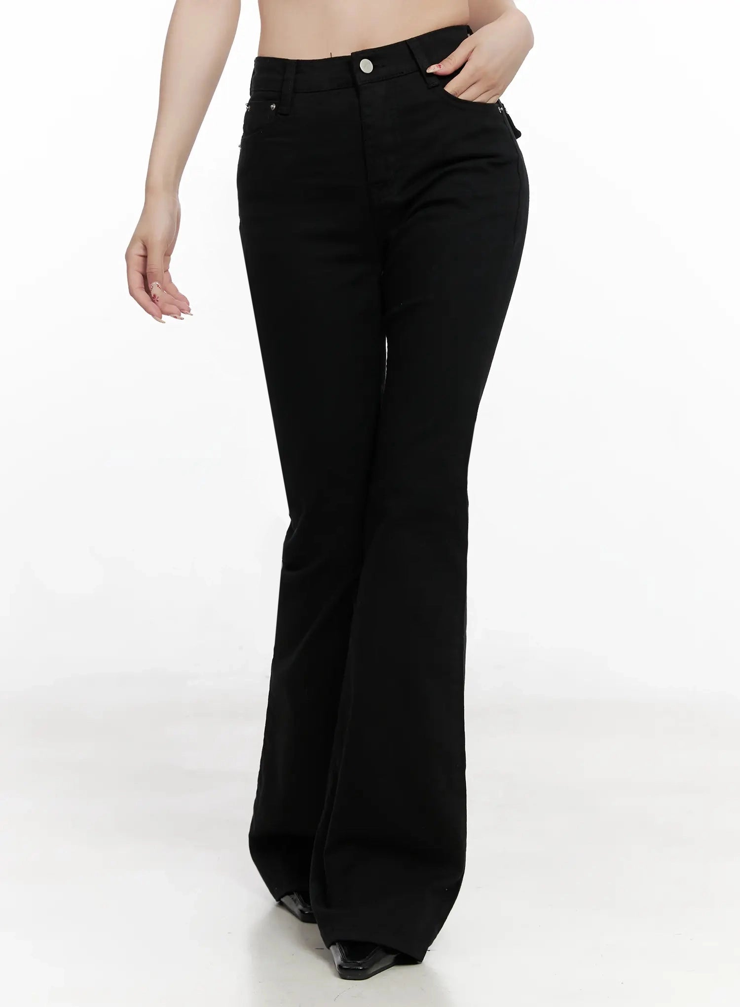 Dream Chic Black Flare Jeans IN514 in black, front close-up on model from hip to knee, high-waist fit with silver button, front pocket stitching, sleek cotton-spandex surface.