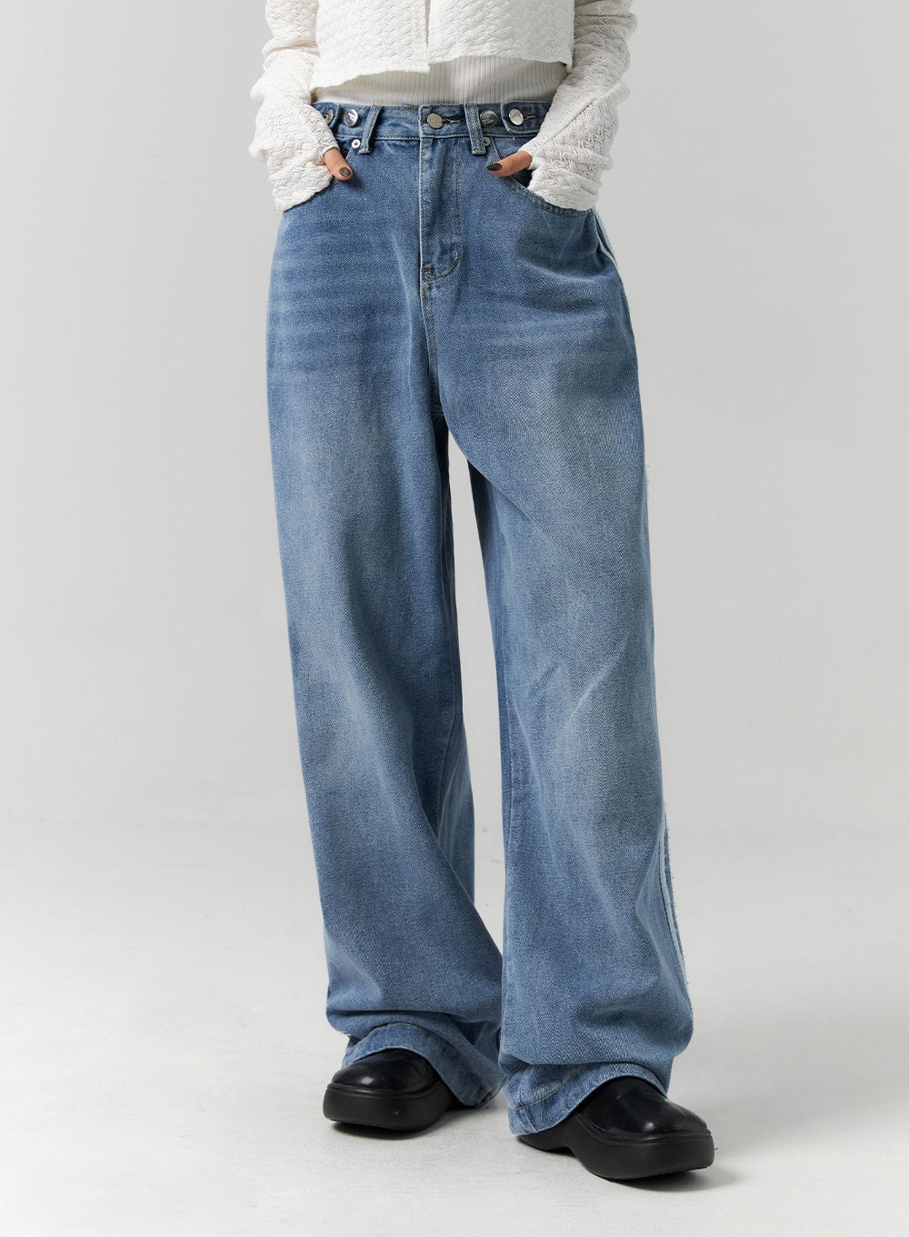 Side Stripes Wide Leg Jeans CS314 in blue, front waist-to-hem mid-shot on model hands in pockets, washed denim showing fading and creasing, multi-button high waistband detail.