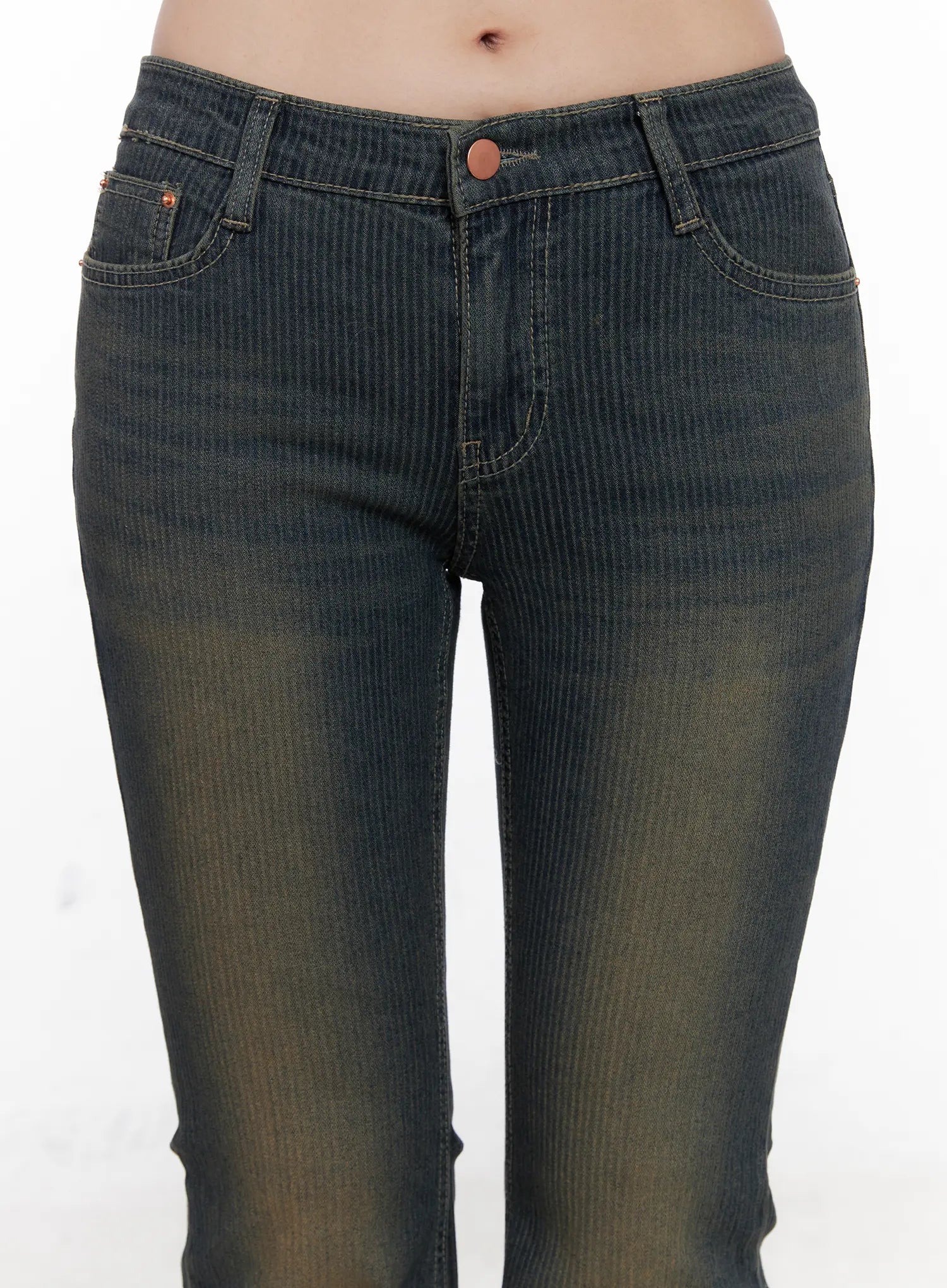 Soleil Hip Pad Stripe Hip Pad Flared Jeans CN512 in dark blue, close-up waist detail on model, washed vertical stripe pattern, low-rise copper button closure, front slash pockets with contrast stitching, hip pad shaping visible.