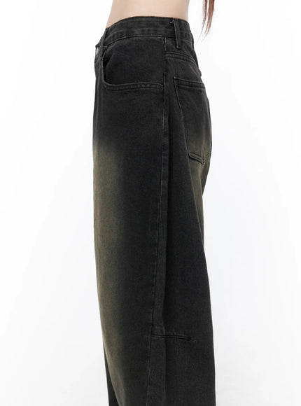 Bodie Vintage Wash Wide Leg Jeans CU519 in black, close-up side upper-half shot, side seam stitching and hip pocket detail, gradient vintage khaki-to-black wash on denim fabric.