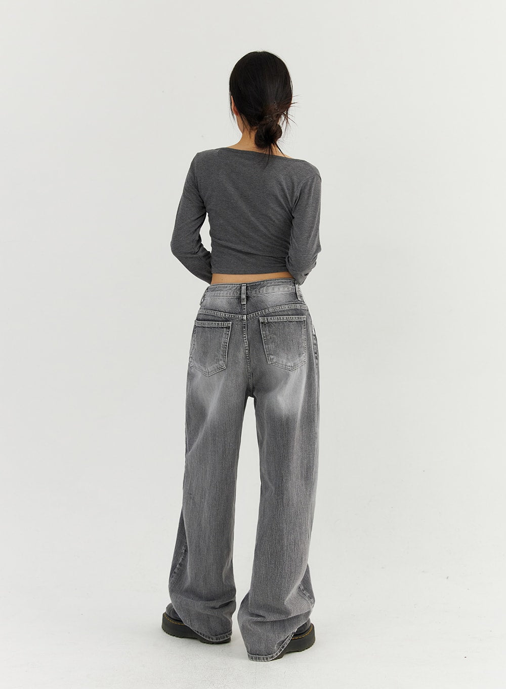 Grey Washed Wide Leg Jeans CO323 in Gray, full-body back view on model, showing back patch pockets, low-rise waistband seam, and extra-wide leg silhouette trailing to the floor.