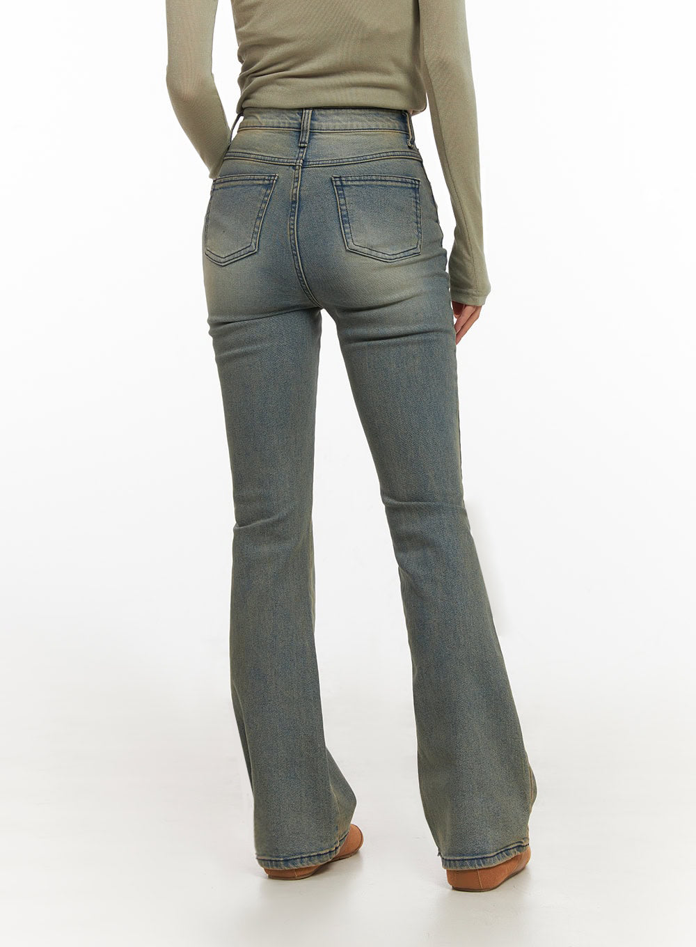Cathy Washed Slim-Fit Flared Jeans IJ503 in vintage blue, back close-up on model, dual back pockets with stitching detail, slim fit through seat and thigh flaring at hem, washed denim.
