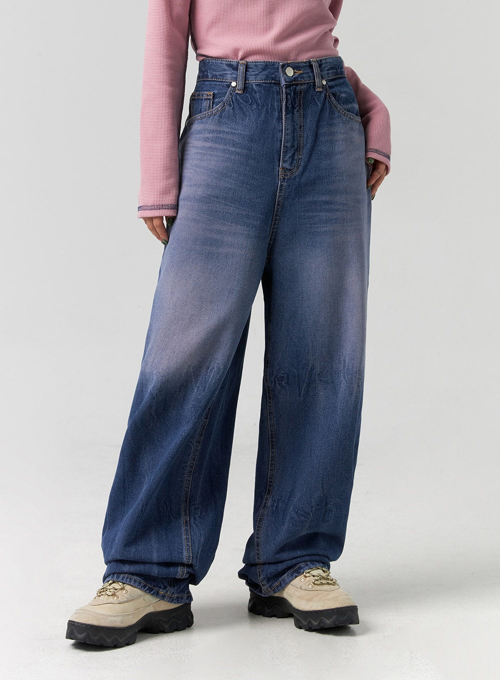 Wide Leg Cotton Jeans CG331 in blue, front lower-body close-up on model, hands in pockets, showing washed denim wide leg with subtle fading and floor-grazing hem.
