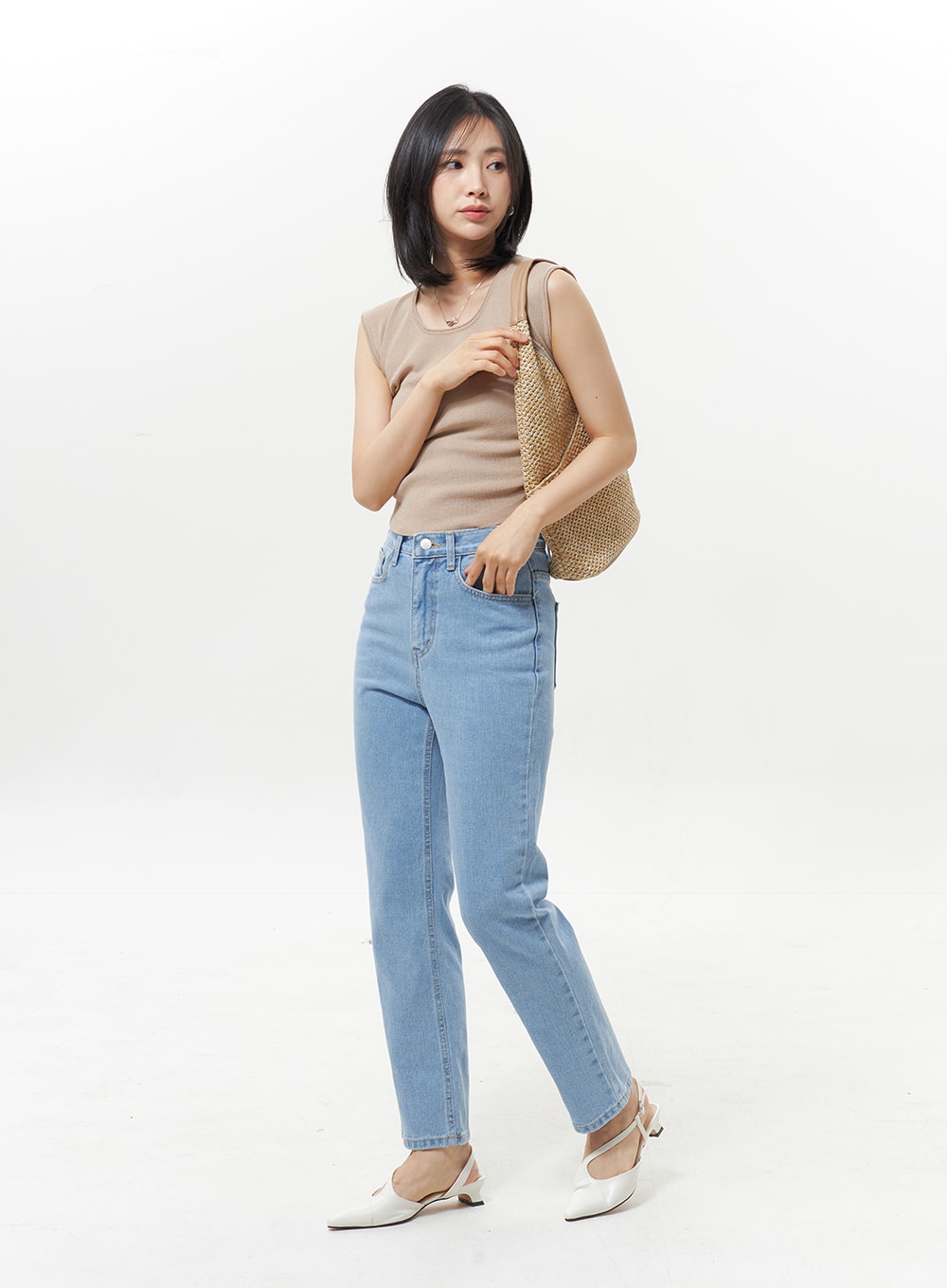 High Waist Jeans OY330 in light blue, full front model shot with accessories, straight-leg high waist denim styled with beige ribbed tank and raffia shoulder bag.