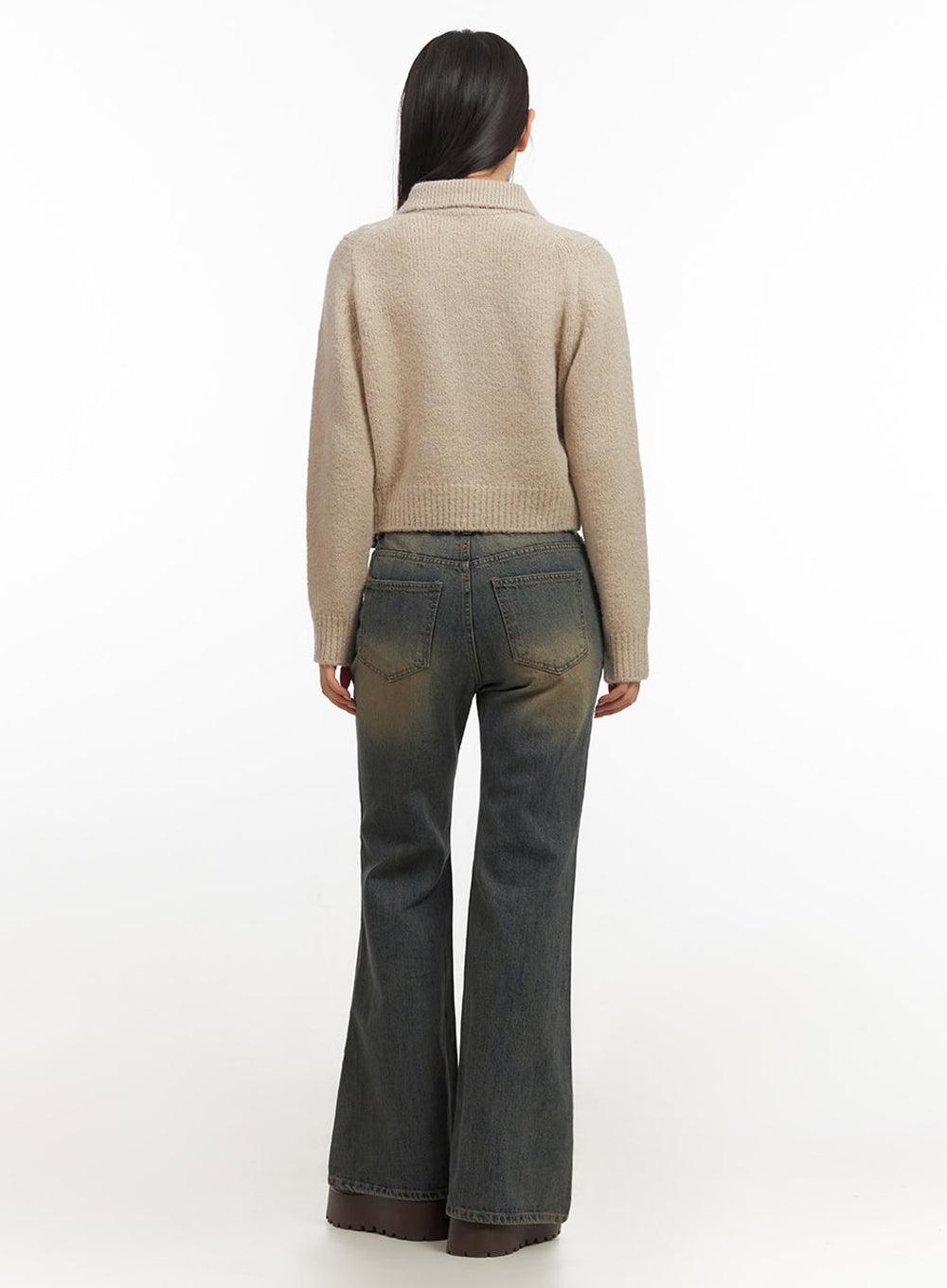 Kourtney Vintage Wash Flared Jeans IF510 in dark blue, full back view on model, showing rear five-pocket construction and flared hem, vintage-washed cotton denim, styled with beige knit top.