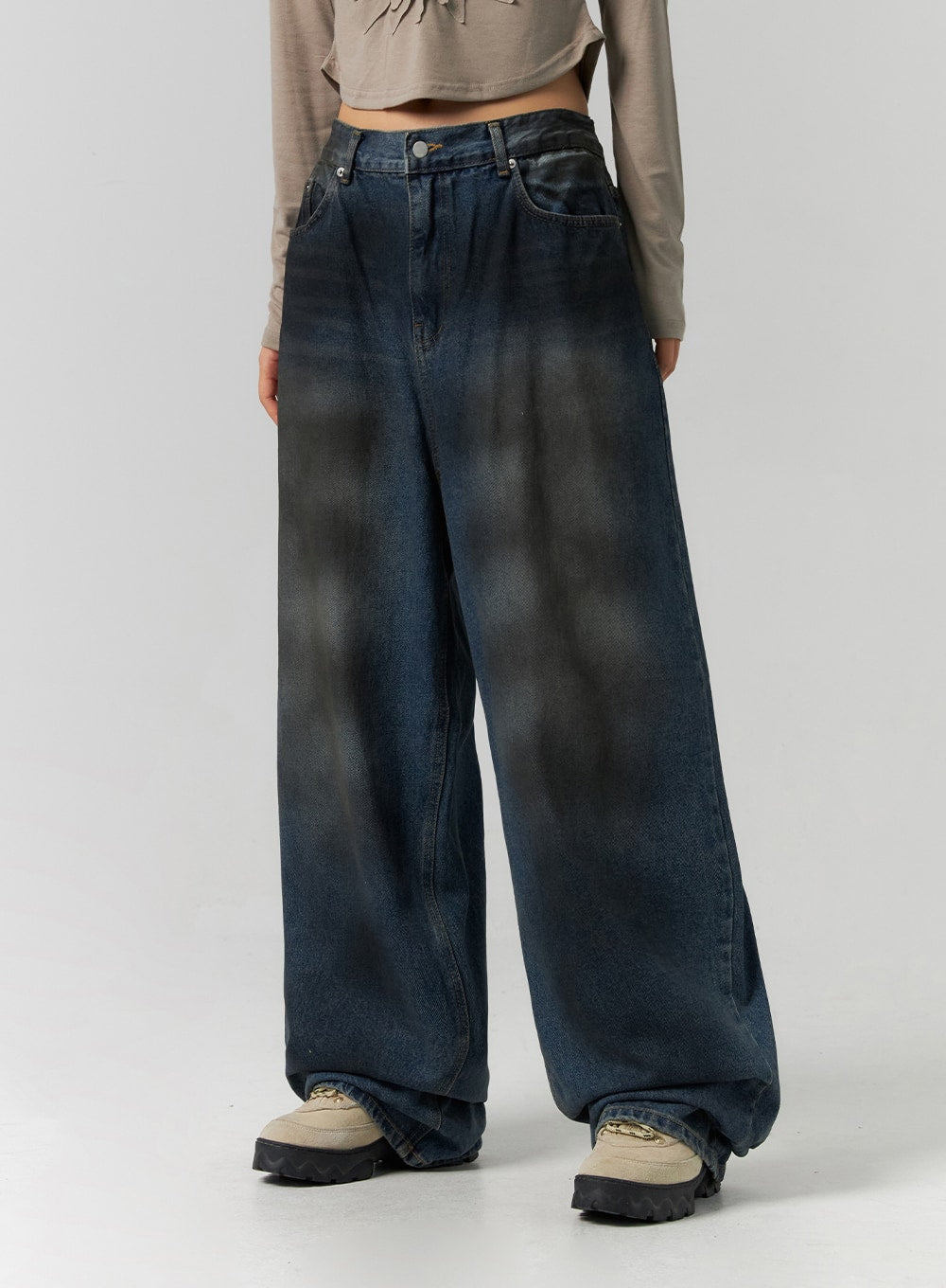 Tie-Dye Washed Wide Leg Jeans CS320 in dark blue, front waist-to-hem close-up on model, emphasizing bold tie-dye wash contrast, wide-leg drape and stacked hem over chunky sneakers.