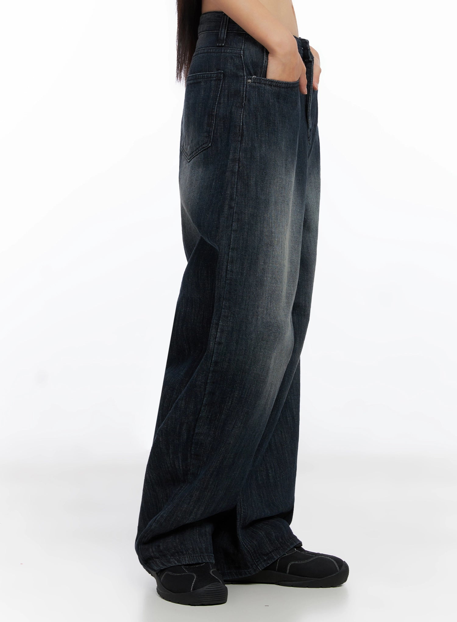 Minnell Vintage-Wash Wide-Leg Jeans IO517 in dark blue, strict side profile on model, showing back pocket stitching, deep vintage fade, and voluminous wide-leg hem pooling at sneakers.
