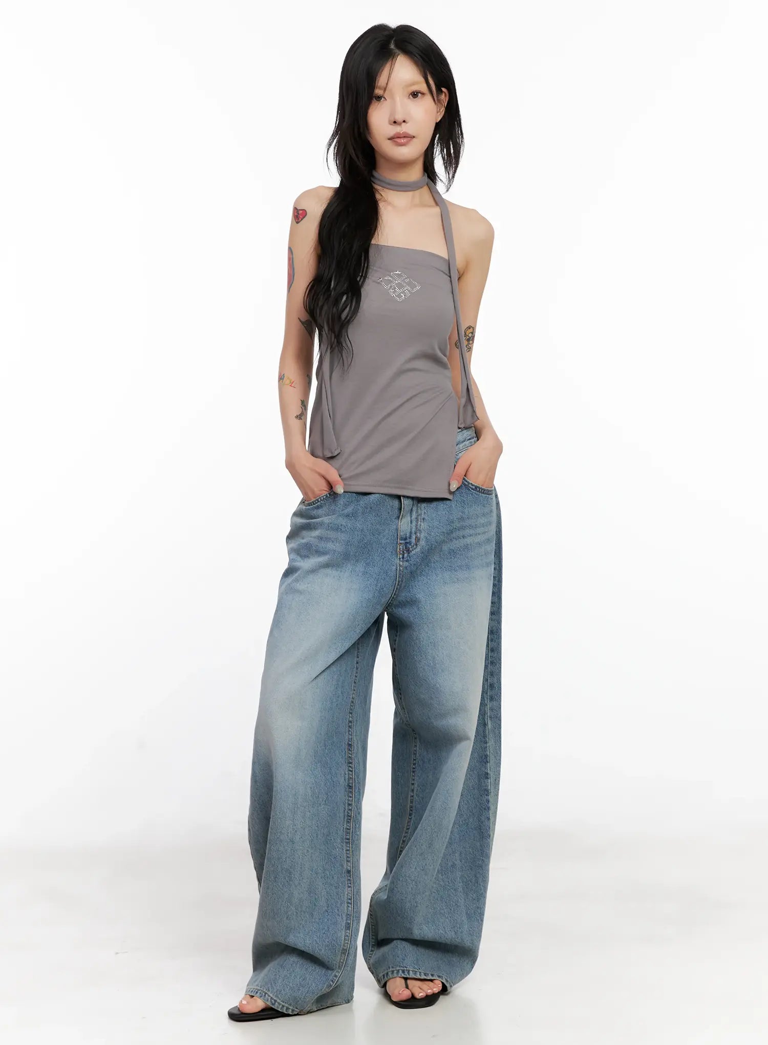 Koko Vintage-Wash Baggy Jeans CL528 in blue, front full-length on model, styled with grey halter top and sandals, showcasing relaxed wide-fit washed denim silhouette.