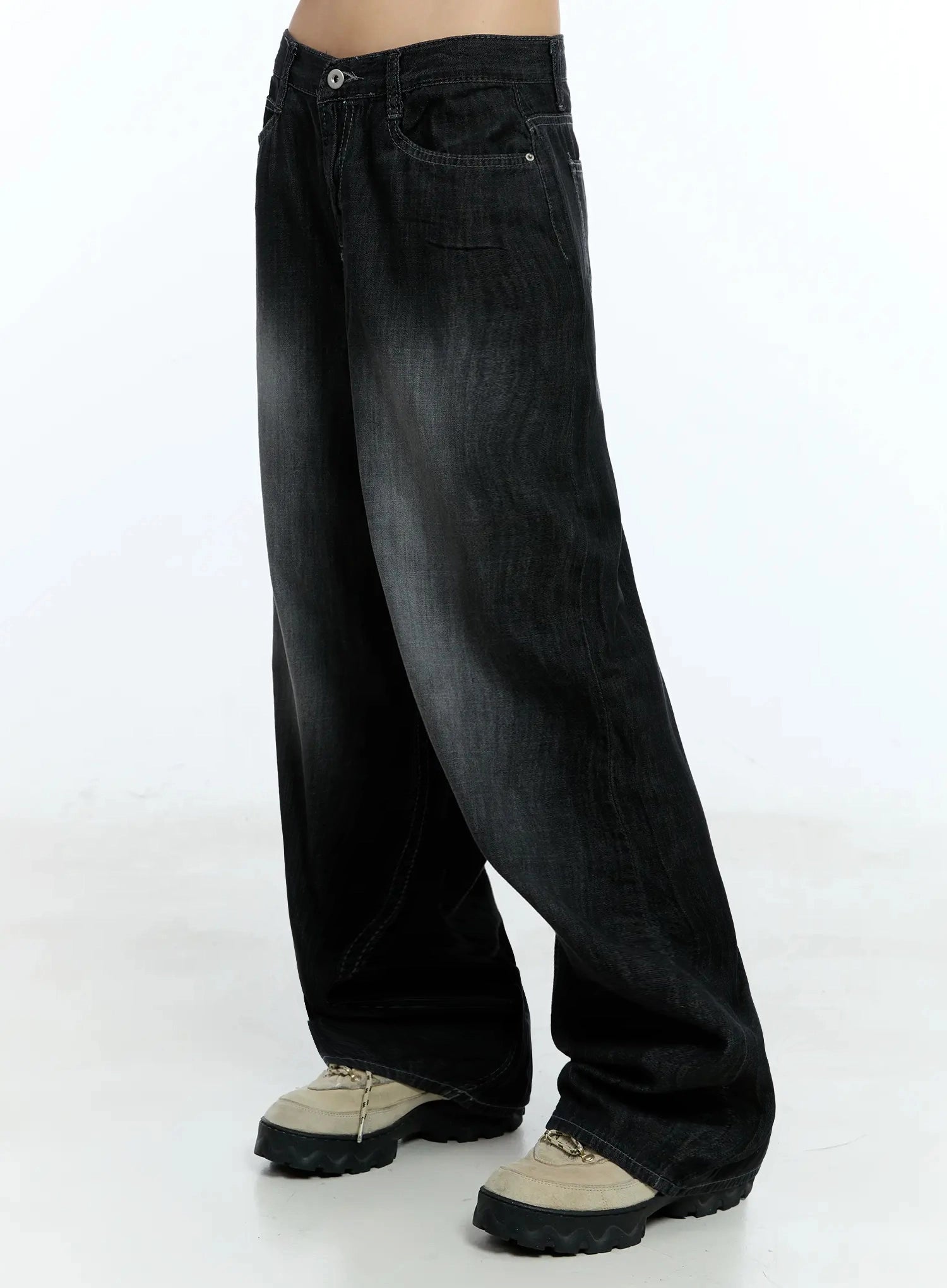 Wendy Washed Wide-Leg Jeans IU524 in black, side-view shot on model from waist to hem, showing voluminous wide-leg drape and washed gradient, hem pooling over chunky sneakers.