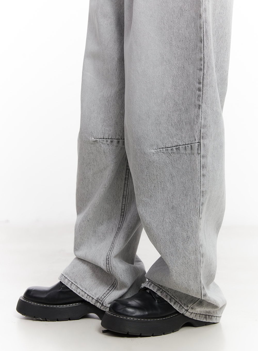 Melisa Washed Wide-Fit Jeans CU506 in gray, lower-leg close-up on model, showing curved panel seam above ankle and extra-wide hem pooling over black chunky loafers.