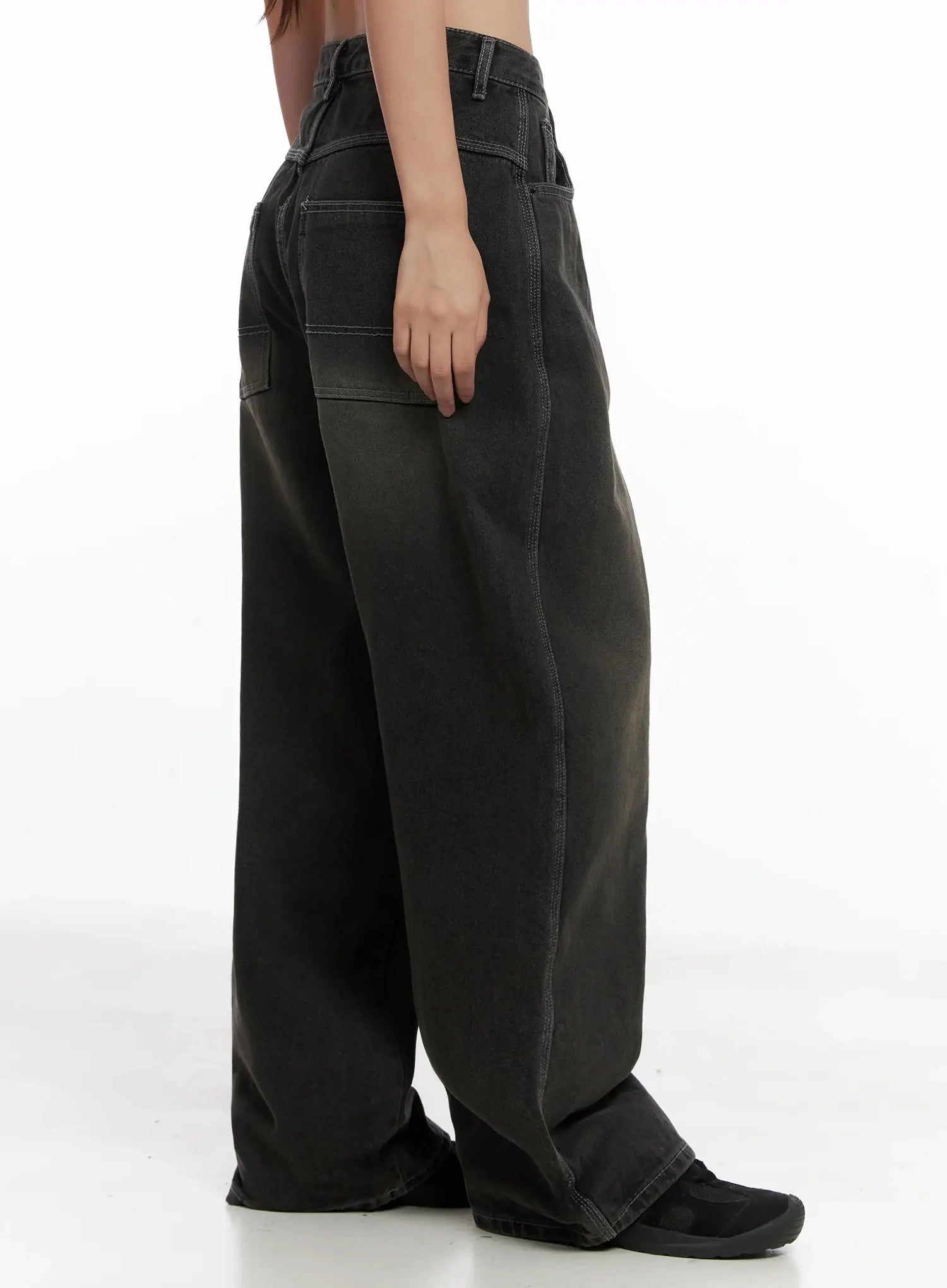 Hari Dark Washed Baggy Jeans IG527 in dark grey, side view on model, contrast white stitching along seams, relaxed baggy wide leg with voluminous silhouette, floor-length inseam.