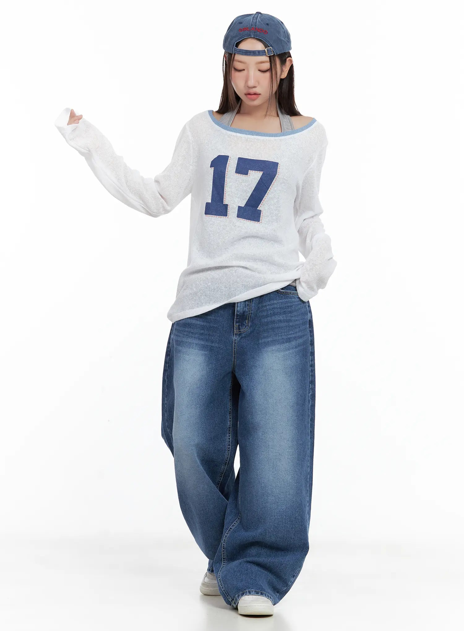 Hayoung Washed Wide-Leg Denim Jeans CL509 in dark blue, full-length front shot on model, styled with white sheer number-graphic knit top and blue baseball cap, street casual look.