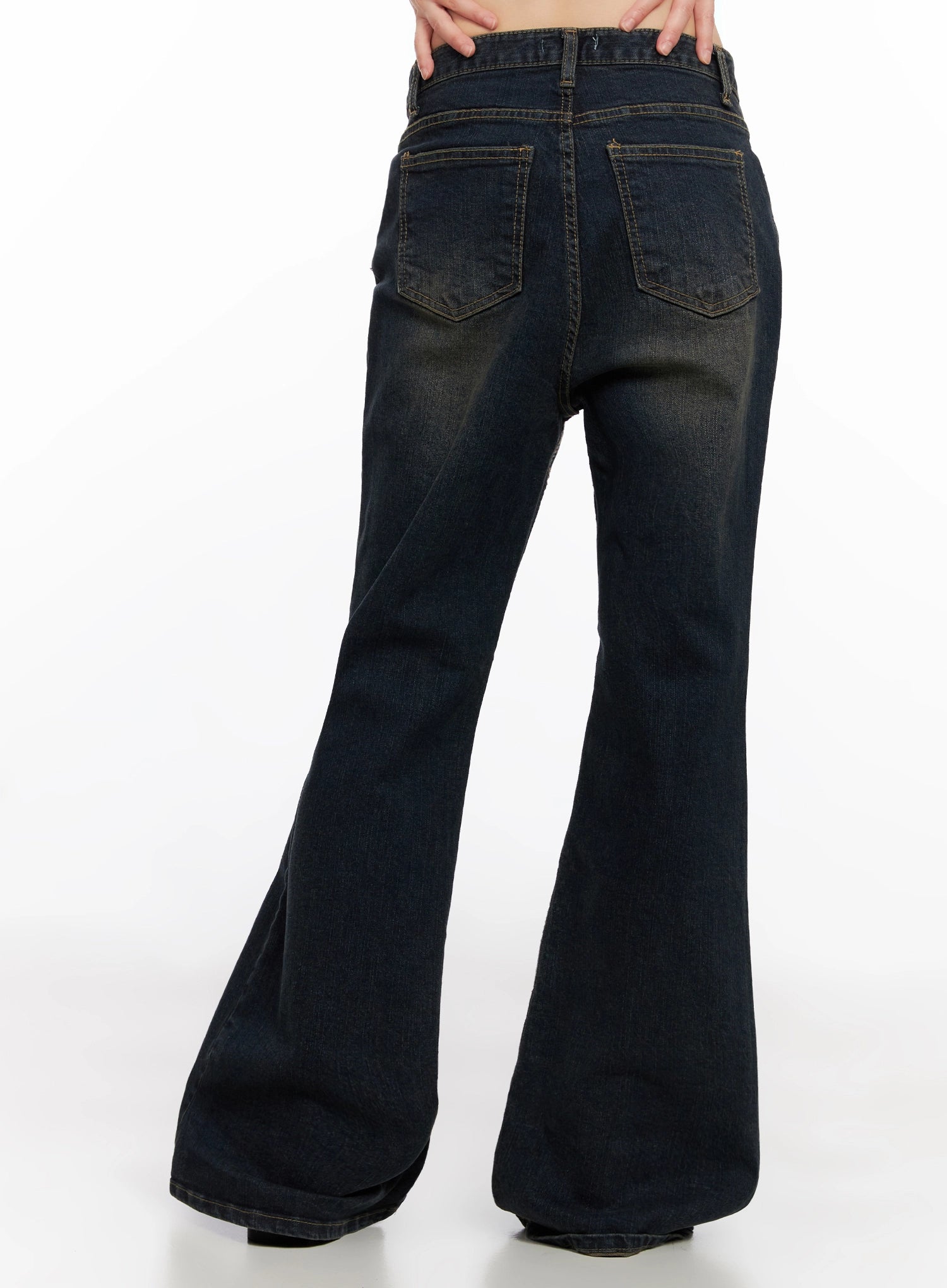 Lyanna Vintage Wash Bootcut Jeans IN503 in dark blue, back view on model, dual back pockets with contrast stitching, wide bootcut flare, vintage wash fading visible.