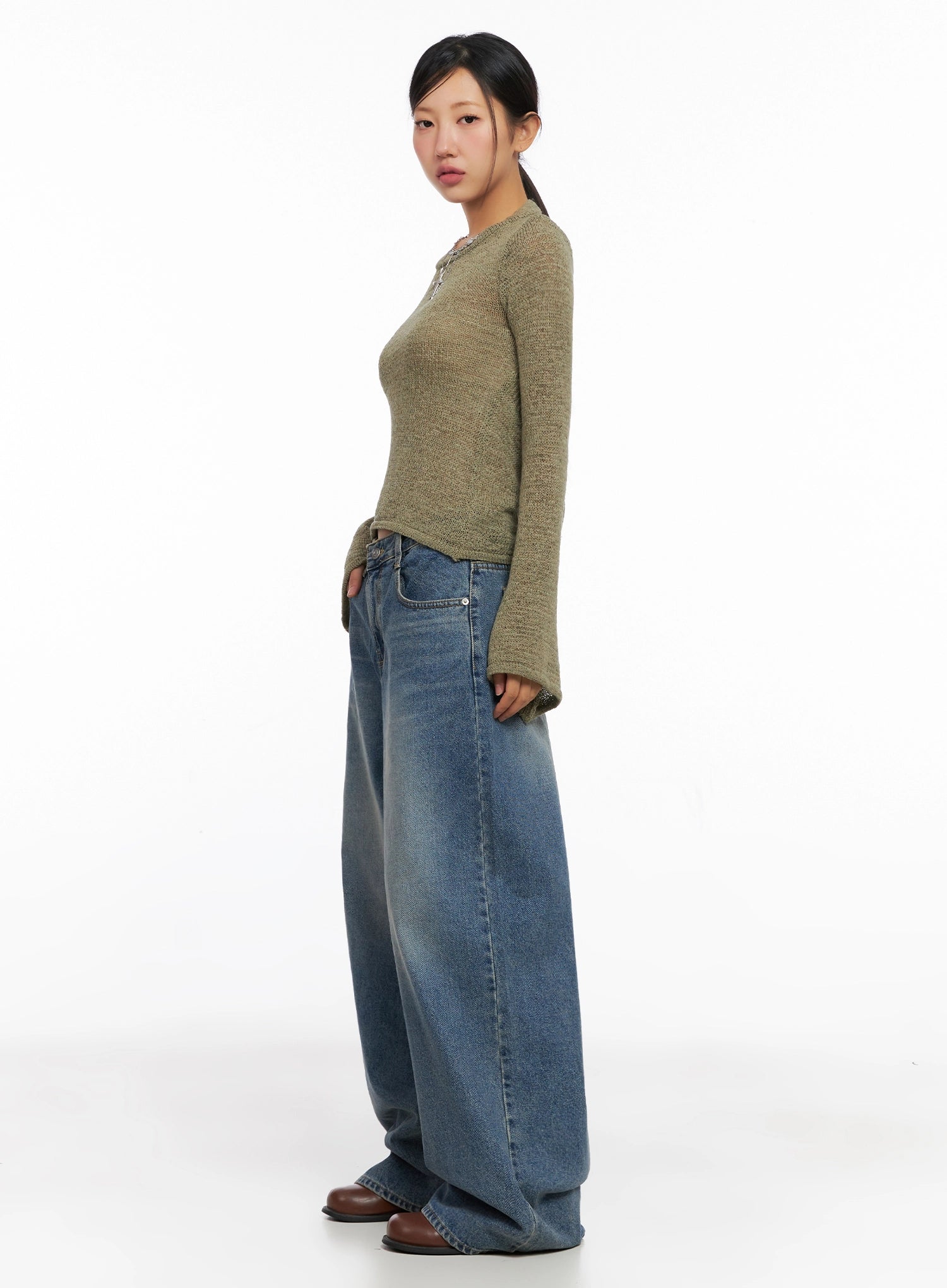 Lilah Wide-Leg Washed Jeans IG527 in mid-blue, side view on model, long wide-leg silhouette with side seam and washed fade, styled with olive knit and brown boots.