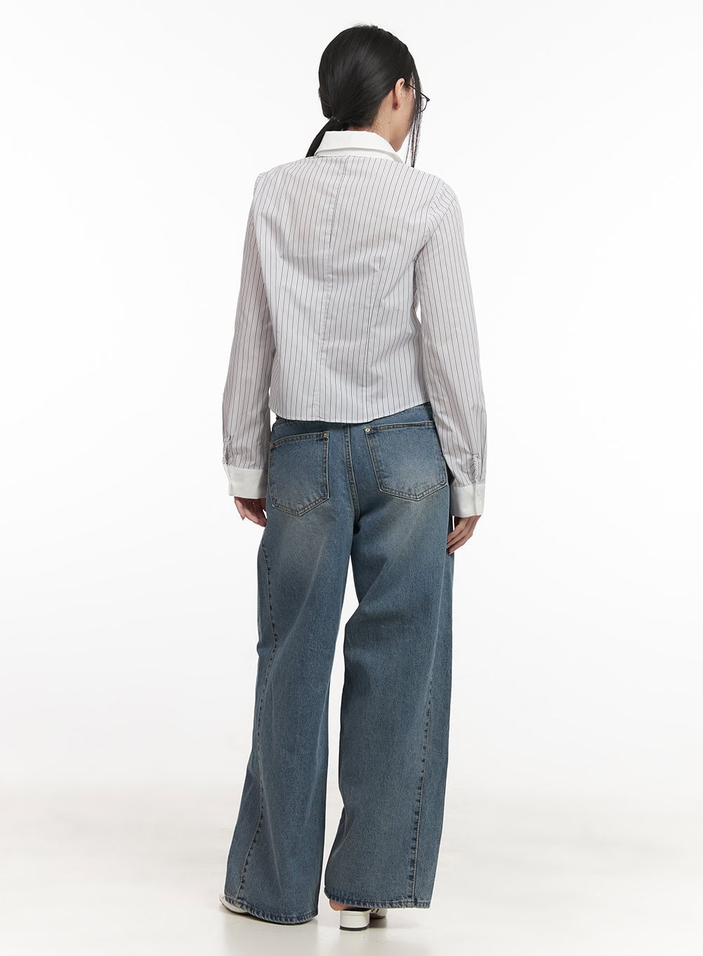 Andrea Wide-Leg Jeans CF514 in blue, full back styling shot, model in striped cropped shirt, washed wide-leg denim with back pockets, floor-grazing hem, white mules.