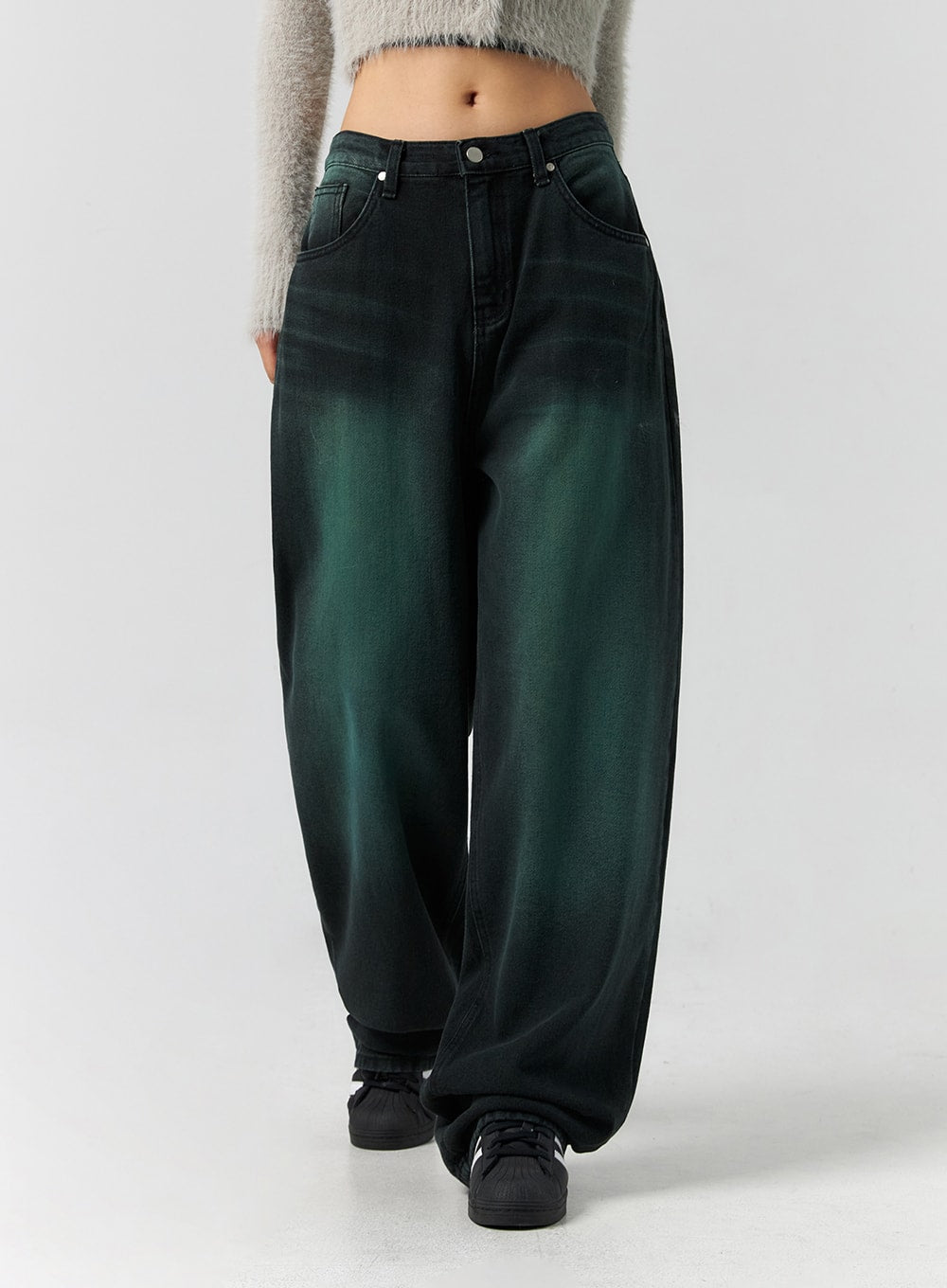 Comfy Wide Leg Color Jeans CS305 in dark green, front mid-shot on model walking, wide-fit cotton denim with bold green gradient fade, five-pocket styling, paired with black sneakers.