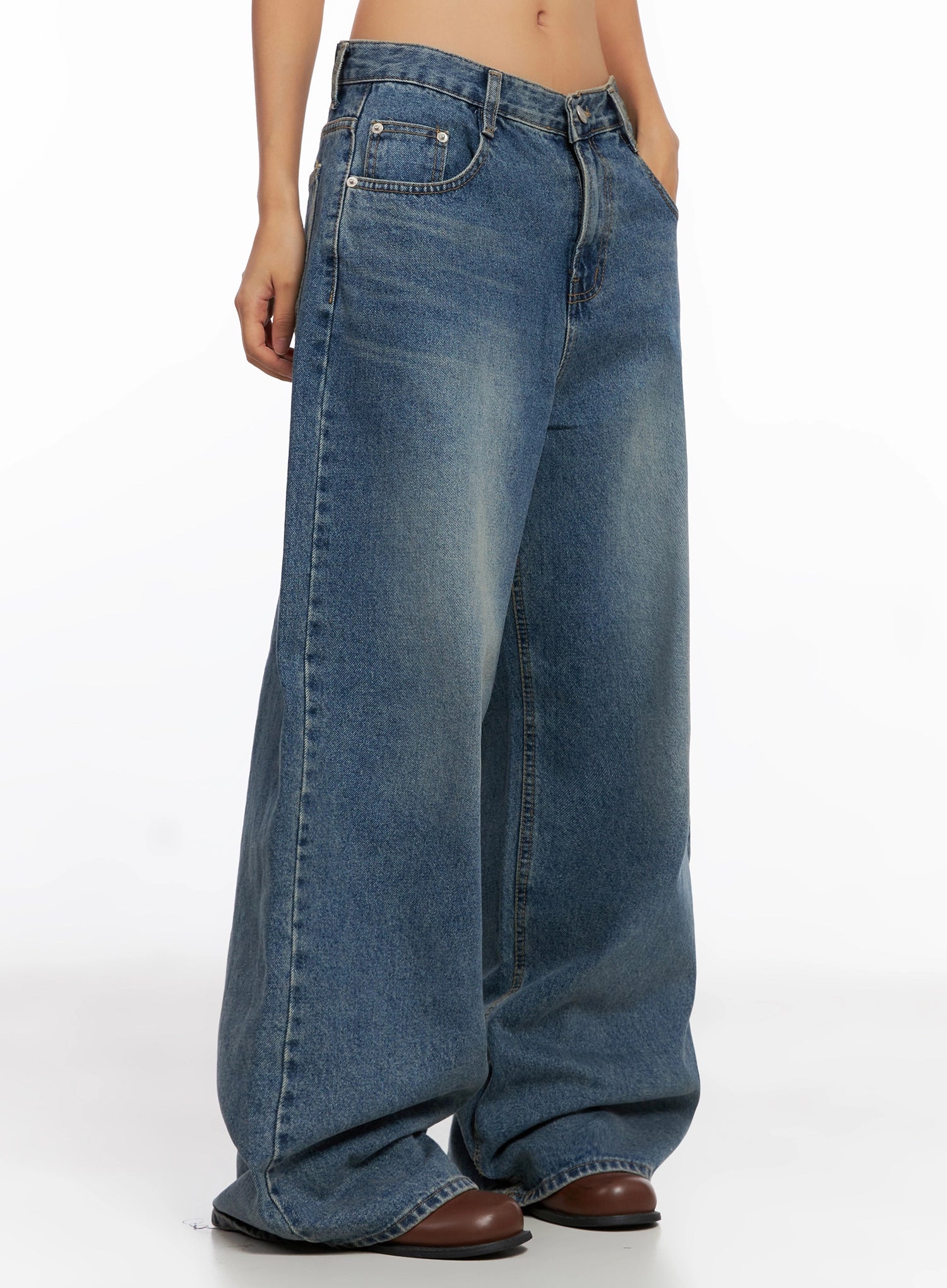 Lilah Wide-Leg Washed Jeans IG527 in mid-blue, side close-up from waist down on model, washed gradient and wide-leg drape highlighted, with front pocket detail visible.