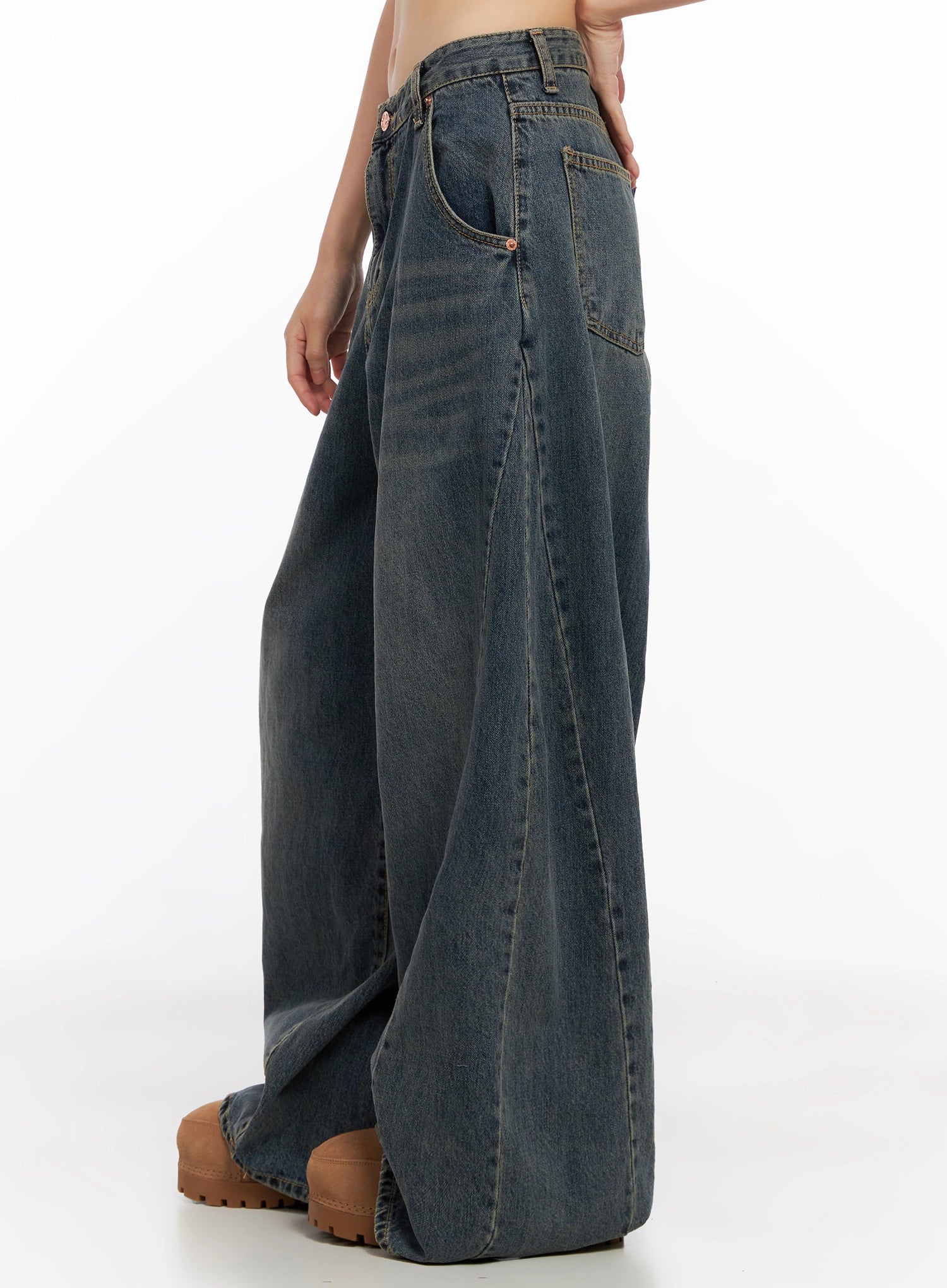 Skyler Washed Balloon Fit Jeans IN503 in blue, side waist-to-hem shot on model, highlighting side pocket placement and wide balloon silhouette, washed indigo cotton, long leg.