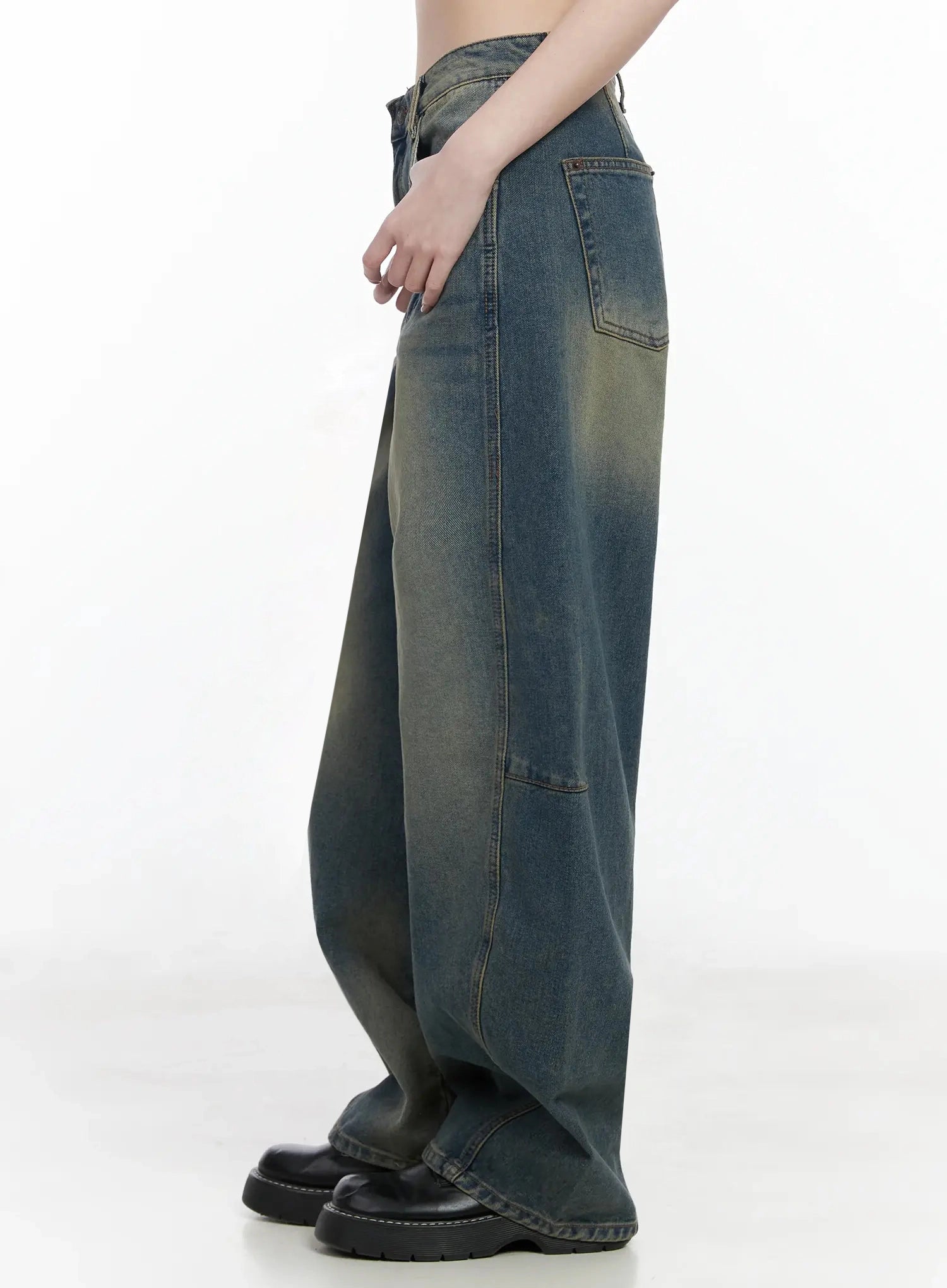 Tata Vintage Dark Blue Washed Wide Leg Jeans IJ528 in dark blue, side-view cropped shot from waist to ankle, curved wide leg silhouette with horizontal panel seam detail, yellow-green vintage wash on outer thigh, back pocket visible.