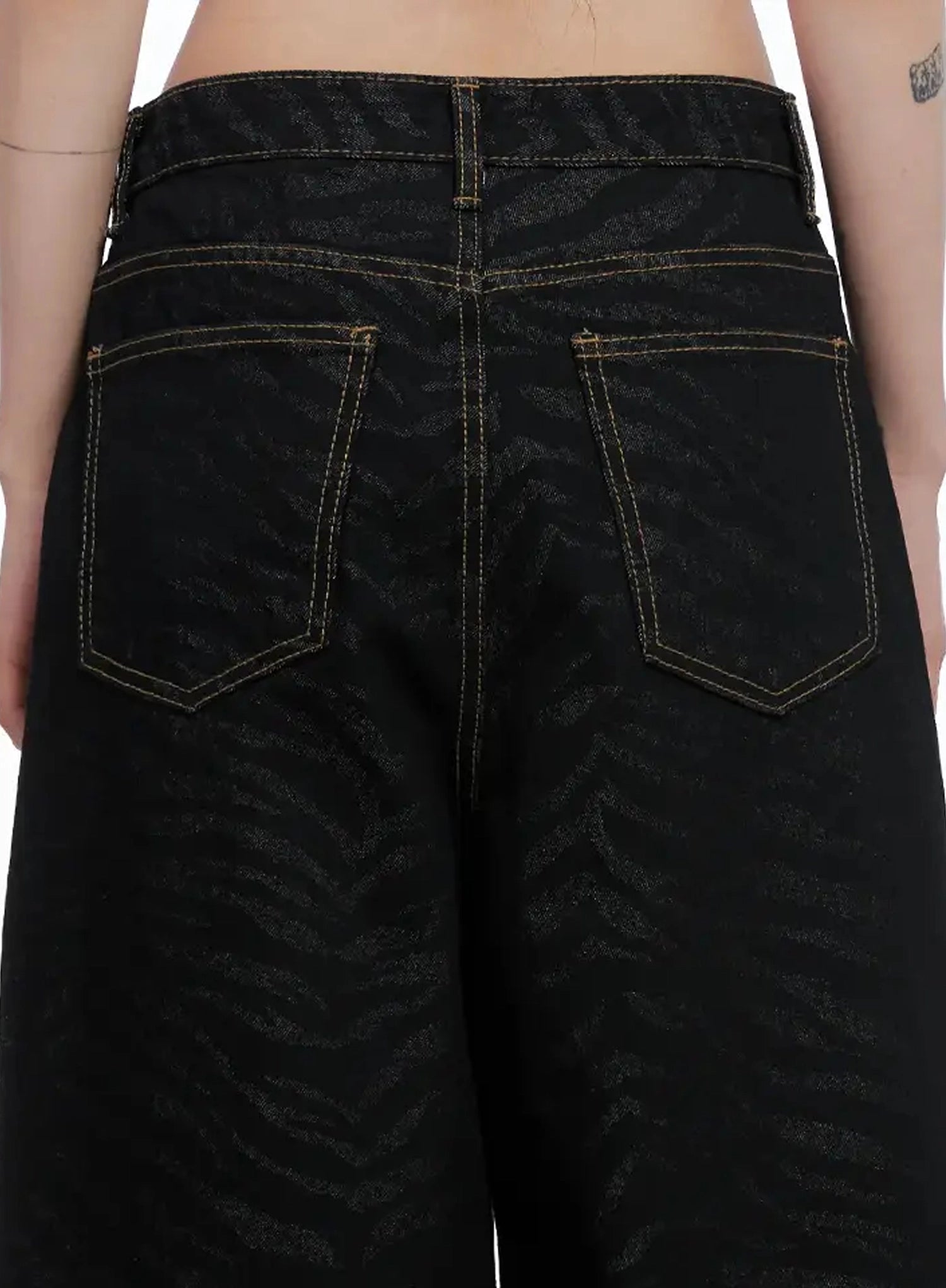 Freyja Animal Print Wide Leg Jeans IS508 in black, back waistband close-up, zebra-jacquard denim with dual patch pockets and gold contrast topstitching detail.