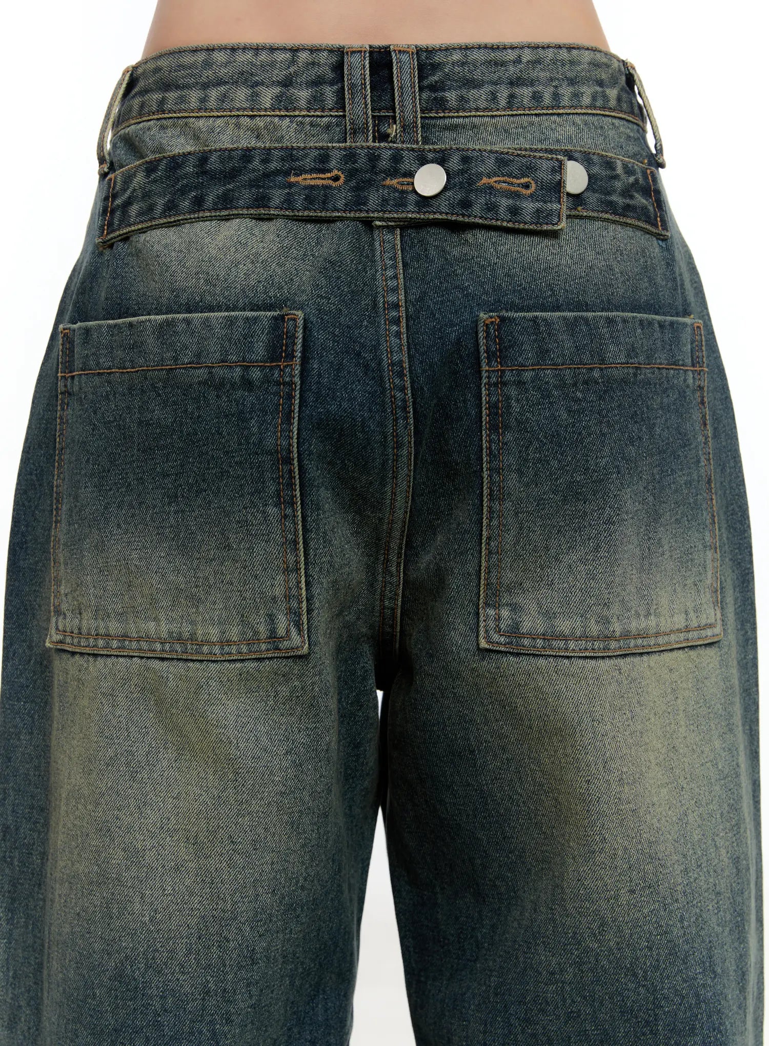 Lilian Vintage Wash Wide-Leg Jeans CS518 in vintage blue-green, back waist close-up on model showing large patch pockets, contrast stitching, snap hardware, and faded denim texture.