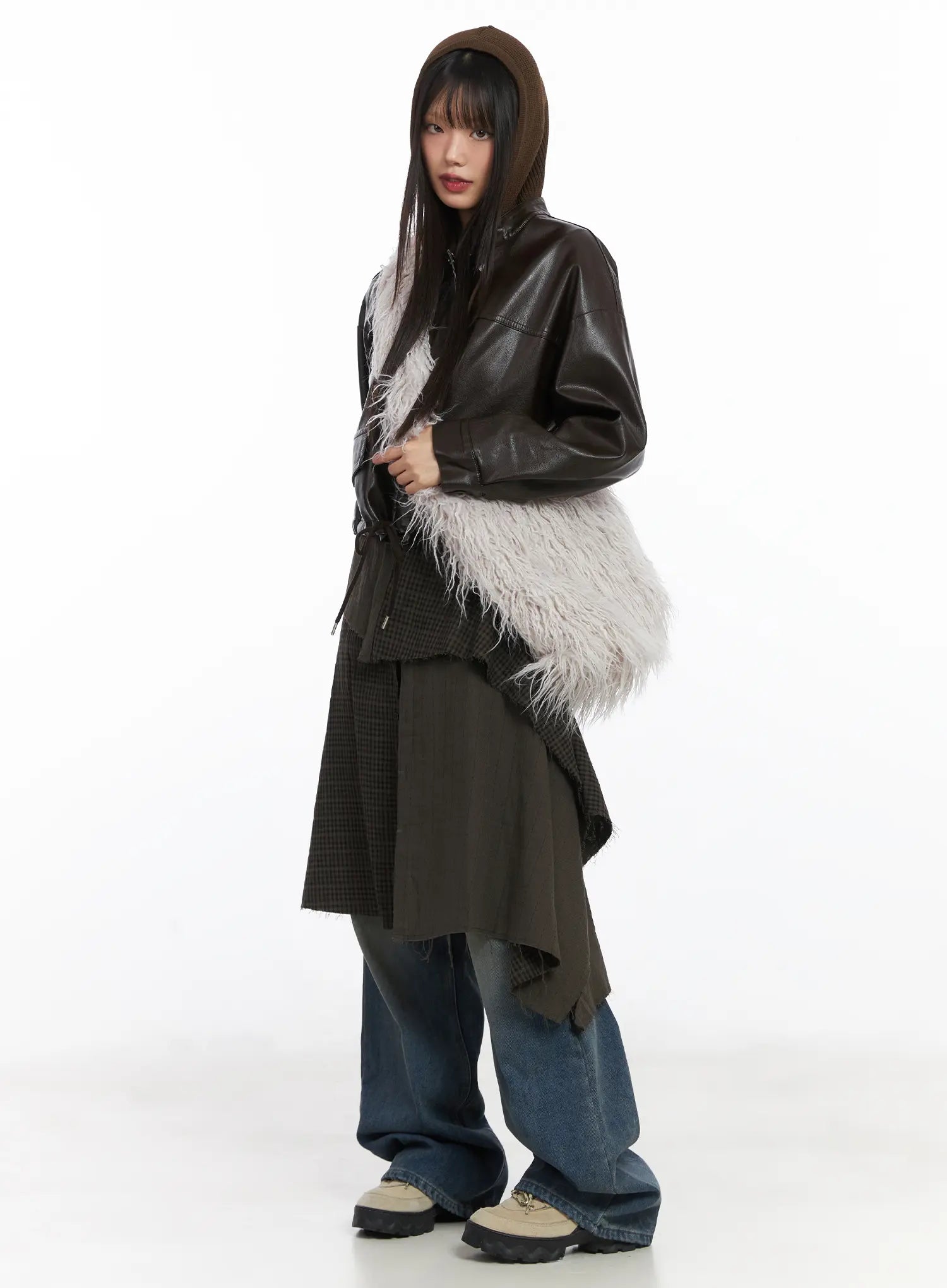 Miriam Wide Leg Jeans CD519 in blue, full-body front 3/4 angle on model, styled with dark leather jacket, hooded knit, asymmetric skirt and shaggy faux-fur bag.