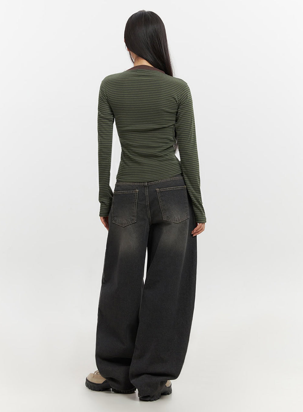 Skyla Washed Wide-Leg Baggy Jeans IF511 in washed black, back full-body shot on model, rear view of baggy wide-leg fit, back pockets and washed cotton denim texture, paired with striped top.