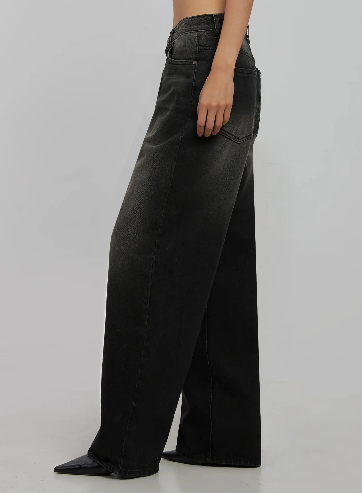 Blaire Dark Washed Wide Leg Jeans IJ509 in black, side close-up product shot on model, dark washed cotton denim showing side seam, wide leg sweep, and faded mid-tone wash without styling layers.