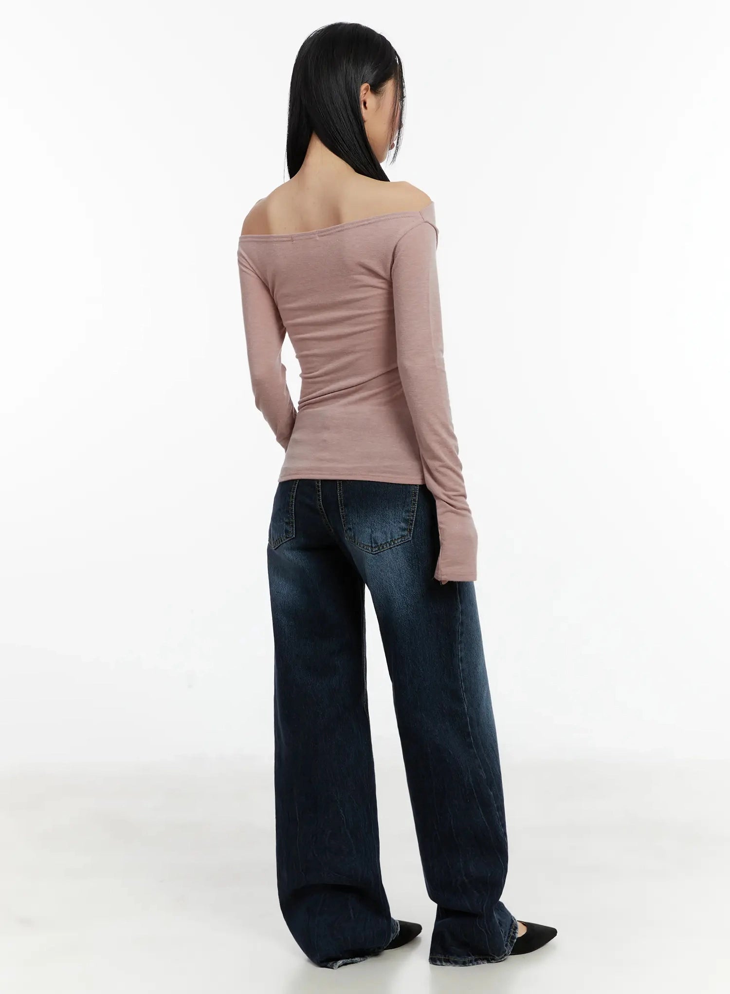 Aimee Low Rise Wide Leg Jeans ID525 in dark blue wash, back full-body shot on model, back pockets with contrast stitching visible, low-rise fit and wide leg, paired with dusty pink off-shoulder top.