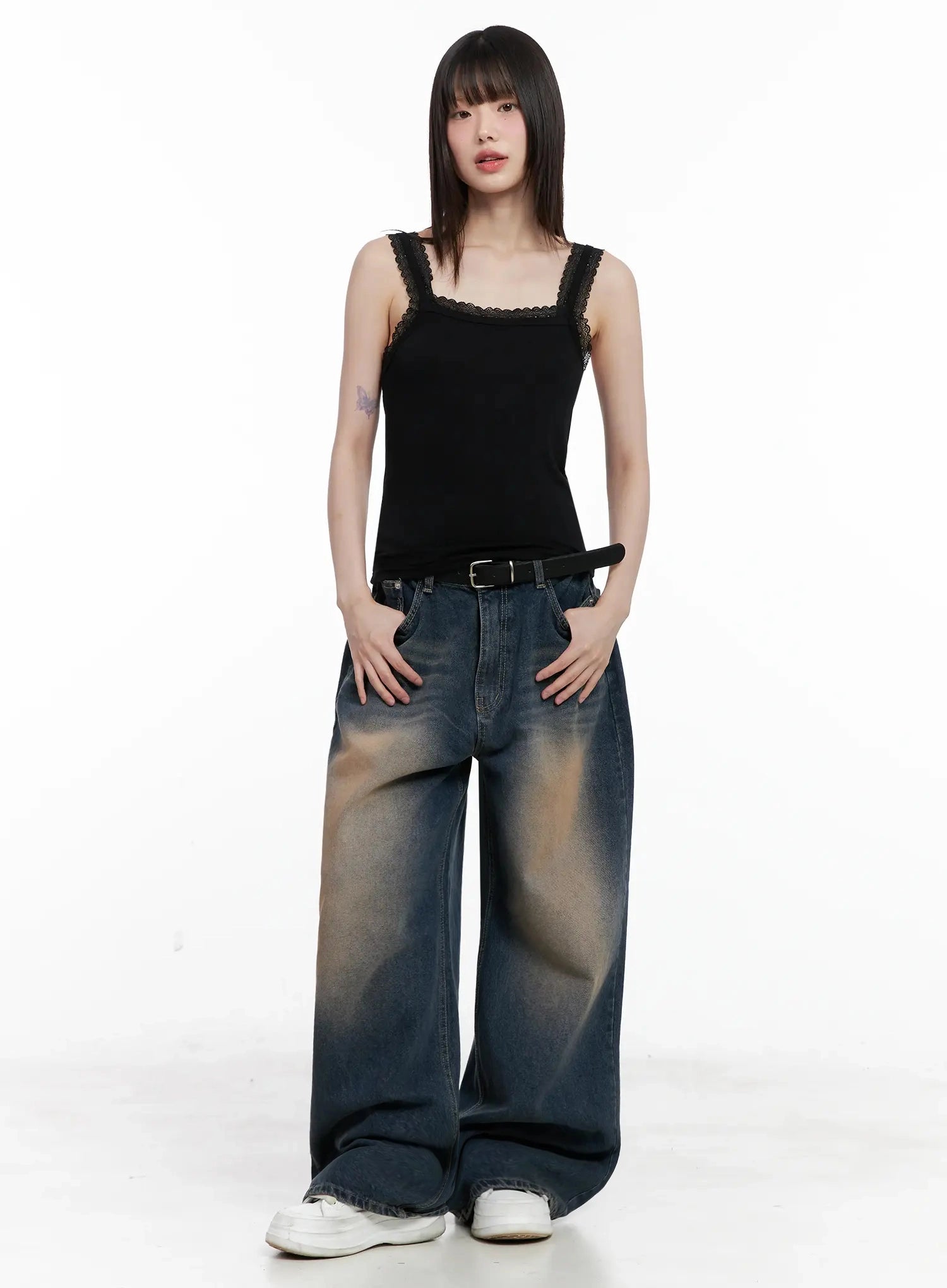 Solji Acid Washed Wide-Leg Jeans IL531 in dark blue, full-body front shot on model, paired with black lace-trim cami and belt, hands in pockets, relaxed street-casual styling.