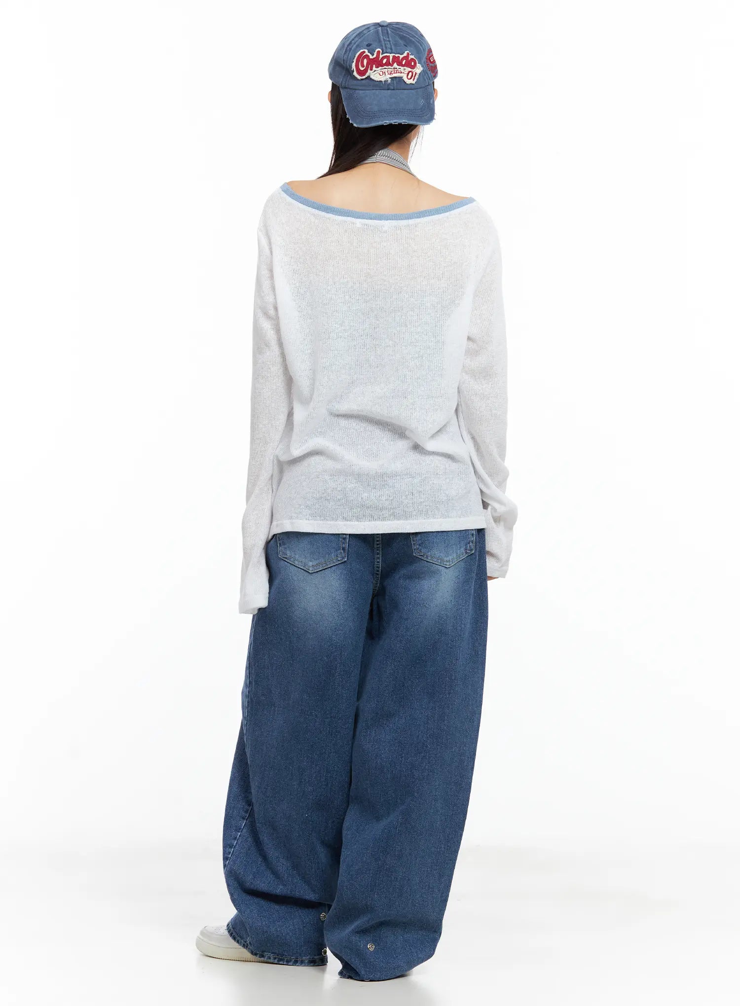 Hayoung Washed Wide-Leg Denim Jeans CL509 in dark blue, full back view on model, rear pockets and extra-wide leg silhouette visible, paired with white sheer top and denim baseball cap.