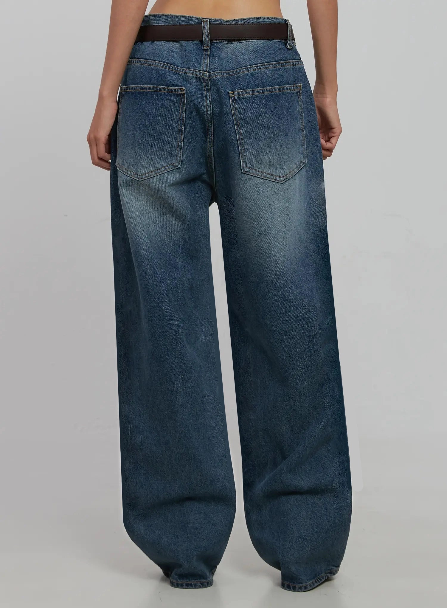 Akira Wide Leg Jeans IJ508 in blue, back view cropped at waist down, washed cotton with two back pockets and faded wash detail, brown belt visible at waistband.