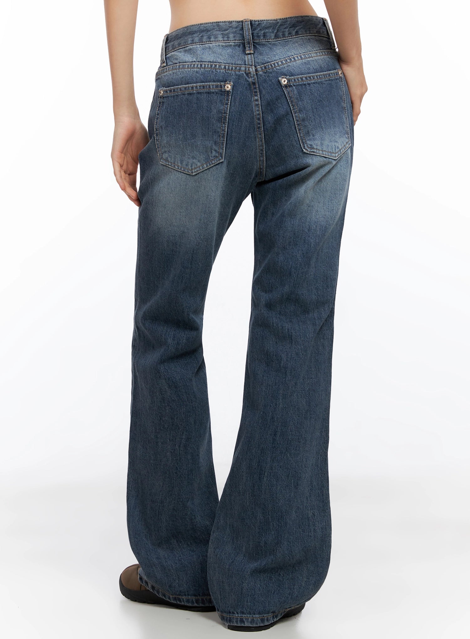 Myra Washed Bootcut Jeans IO516 in dark blue, back view product shot on model, dual rear pockets with contrast stitching, washed denim fading, flared bootcut silhouette.
