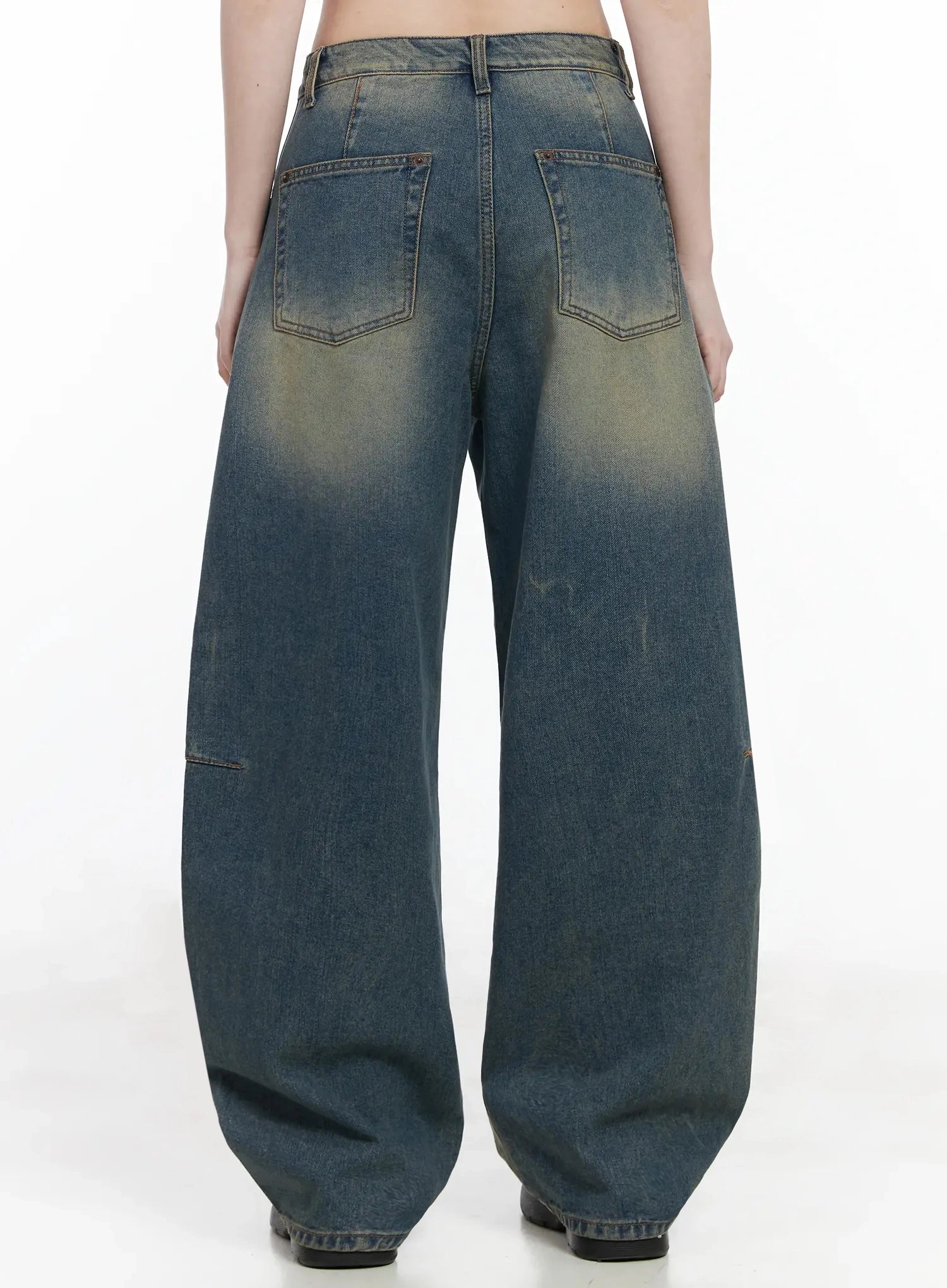 Tata Vintage Dark Blue Washed Wide Leg Jeans IJ528 in dark blue, back full-length product shot on model, two back patch pockets with copper rivets, yellow fade across seat, balloon-shaped wide leg hem pooling at floor.