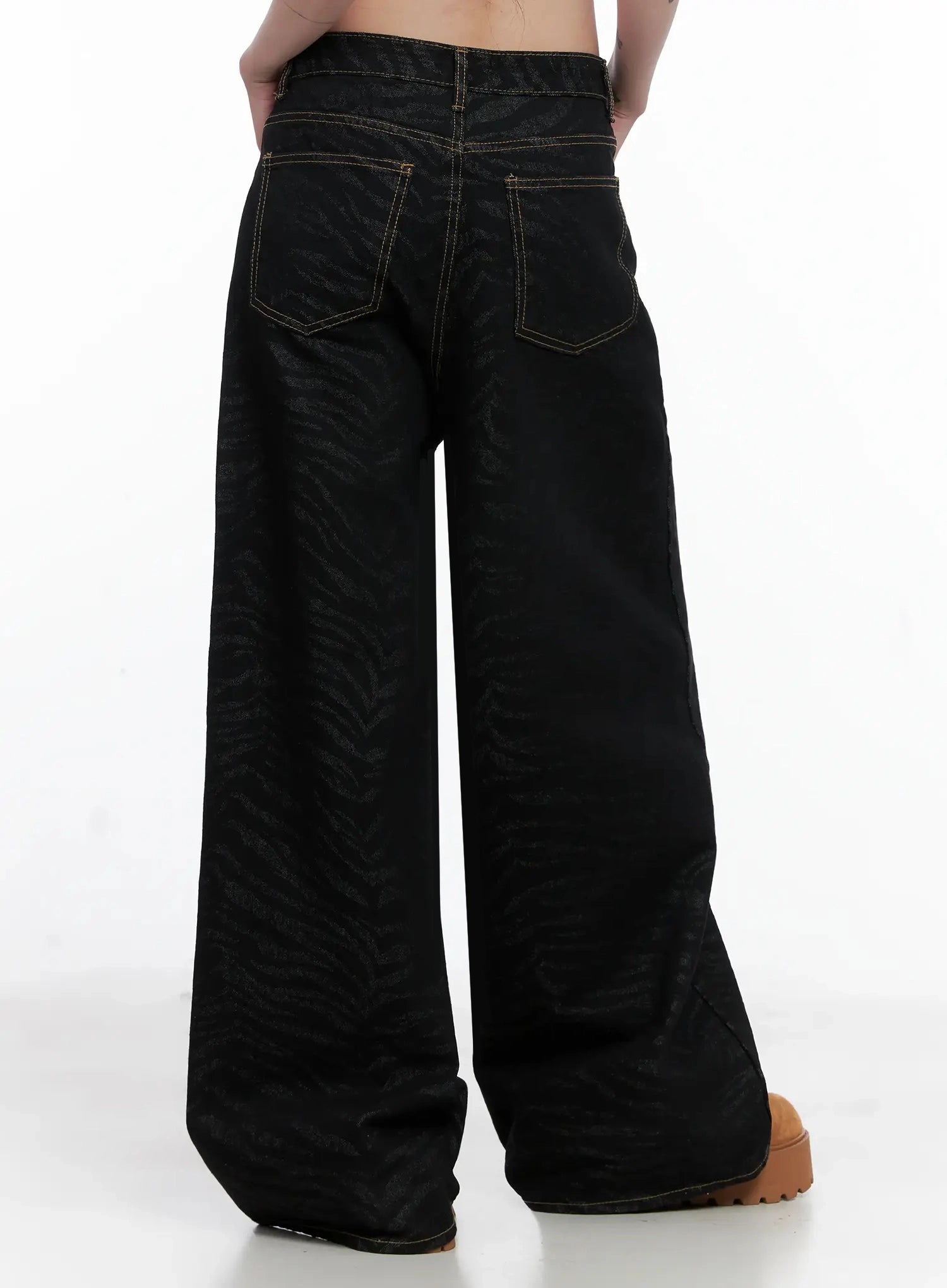 Freyja Animal Print Wide Leg Jeans IS508 in black, back three-quarter view on model, wide-leg zebra-print denim showing full-length silhouette and back pocket placement.