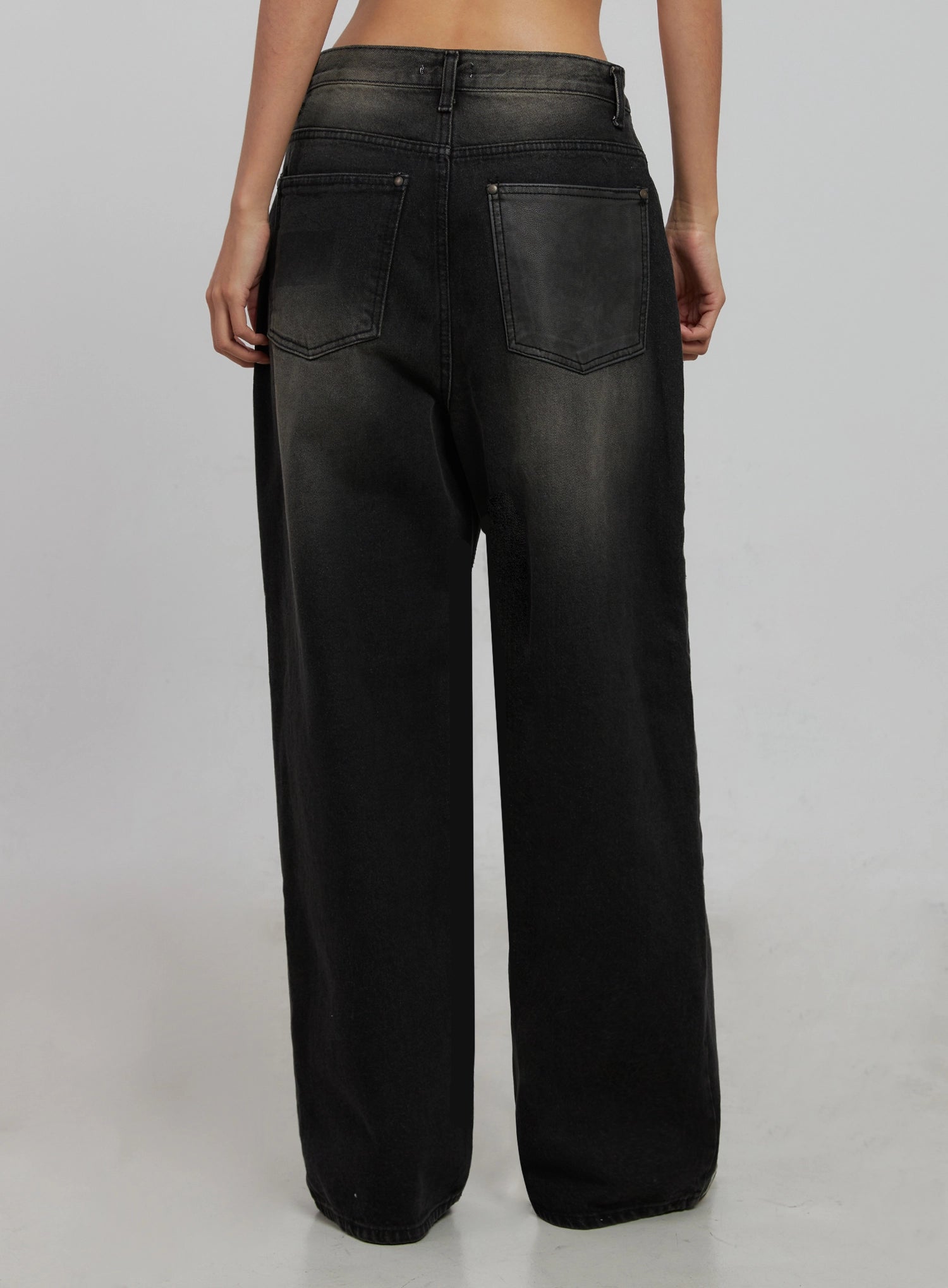 Blaire Dark Washed Wide Leg Jeans IJ509 in black, back product shot on model, dark washed wide leg cotton denim with two back patch pockets, contrast faded waistband, and full-length hem.