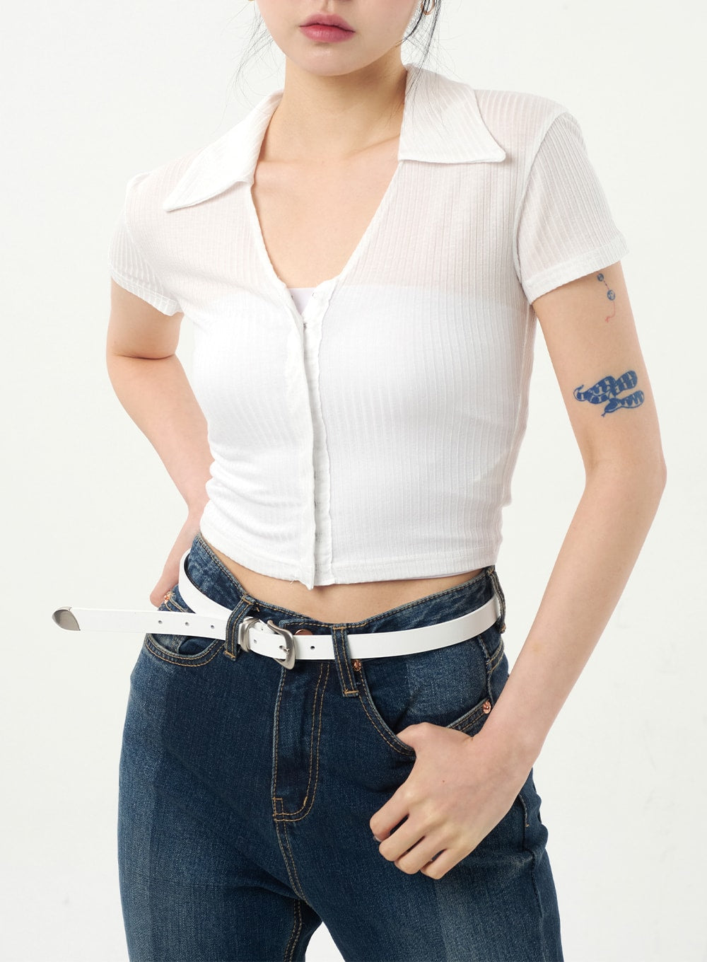 Dark Wash Bootcut Jeans CA328 in dark blue, waist close-up on model, showing high-rise waistband, front pockets with contrast topstitching, and white belt detail.