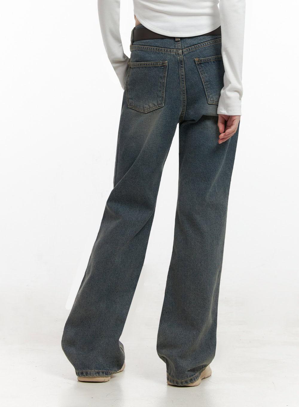 Asher Slimline Washed Bootcut Jeans ID402 in vintage blue, back close-up waist-to-hem on model, five-pocket construction, washed fading detail, black belt at waistband, slim bootcut leg.
