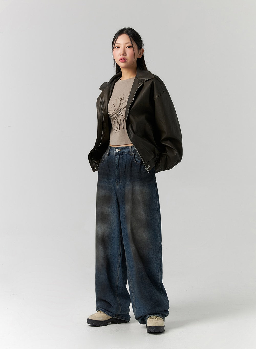 Tie-Dye Washed Wide Leg Jeans CS320 in dark blue, full-body front three-quarter on model, street-style wide leg denim with tie-dye wash, layered under open leather bomber jacket.