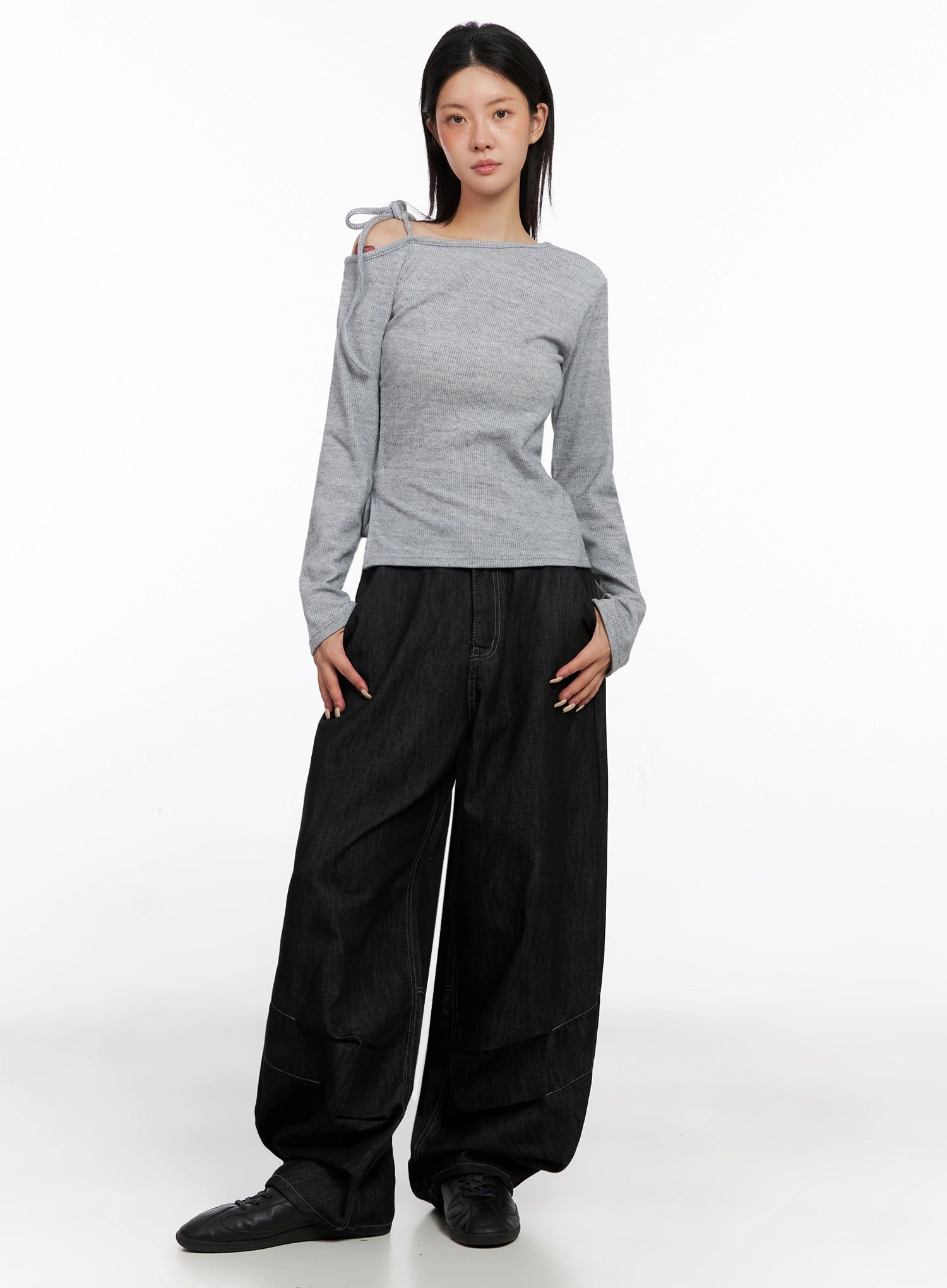 Leyla Pin-Tuck Wide-Leg Jeans IS515 in black, full-length front on model wearing grey cutout top, wide-leg pintuck cotton denim with contrast stitching, styled with black flats.